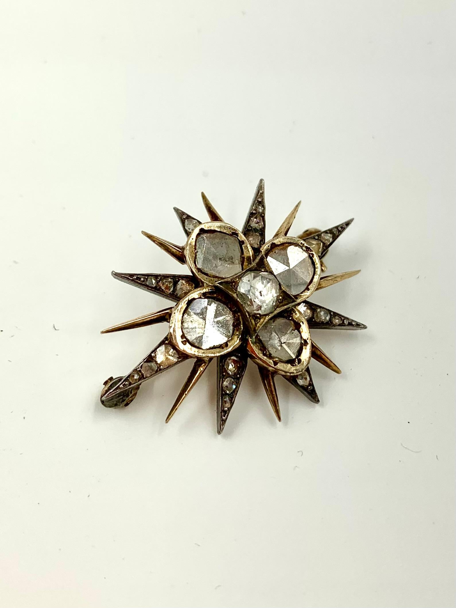 Enchanting 18th Century Georgian period diamond brooch in the shape of a star, retailed by S.J. Phillips with the firm's early heart shaped tooled leather box.
Diamonds: approximately 3 TCW- Old Mine, Rose Cut and Point Cut
Tested for 18K