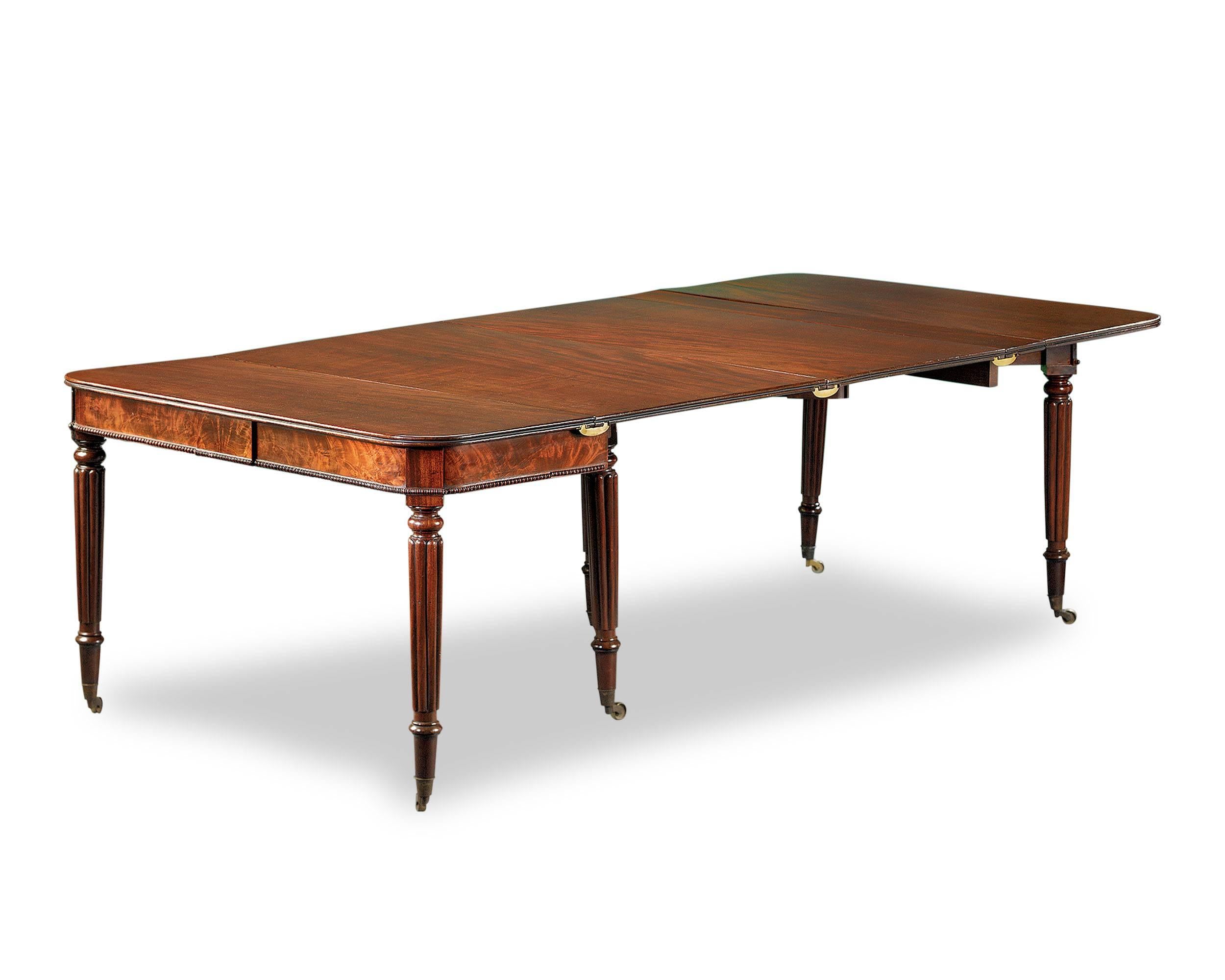 An extraordinary and uniquely designed 18th-century English accordion dining table, beautifully crafted of mahogany. This remarkable piece transforms into a 95