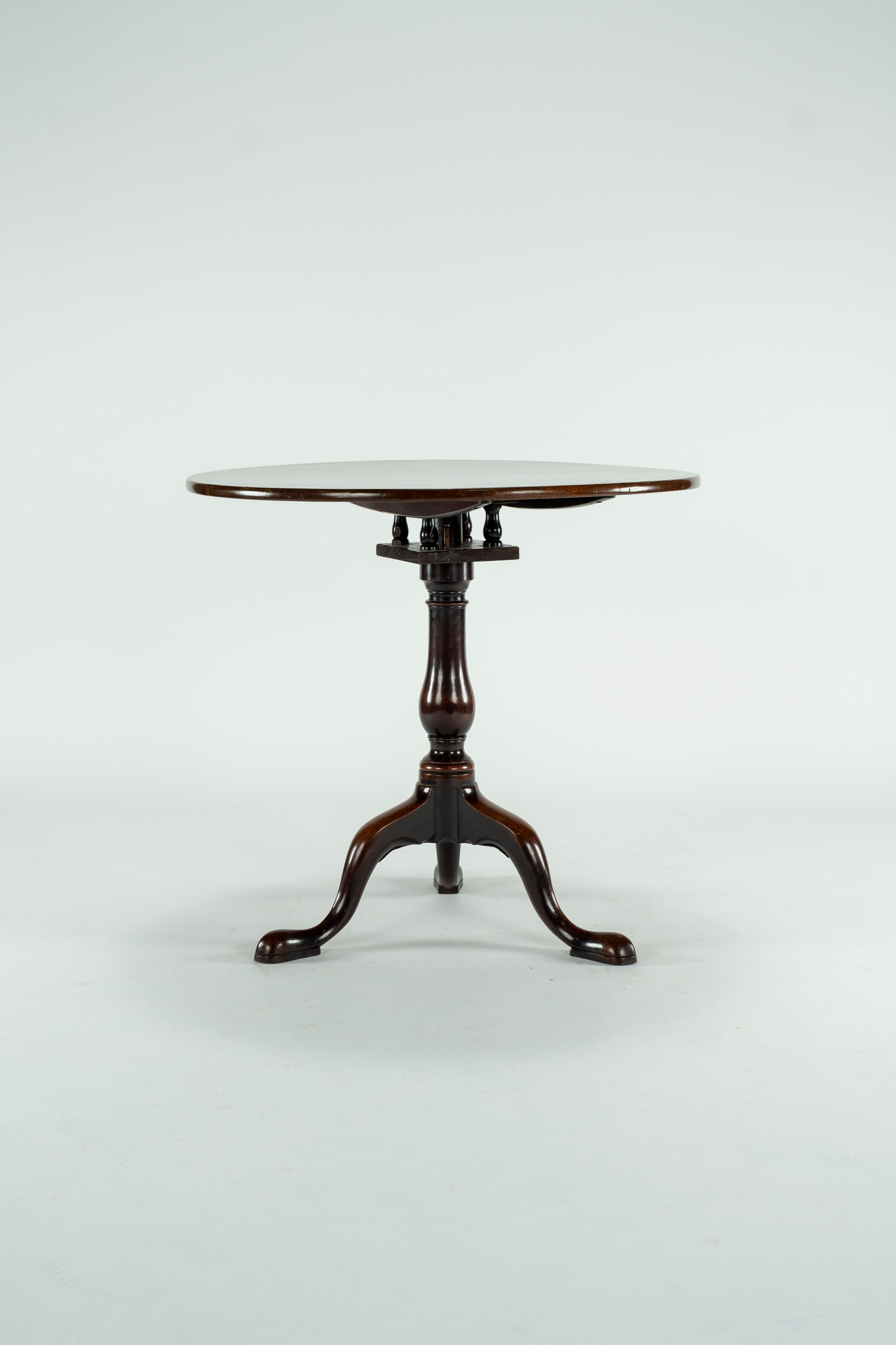 18th century walnut Georgian tilt top table with birdcage on 3 padded feet. Beautiful patina.