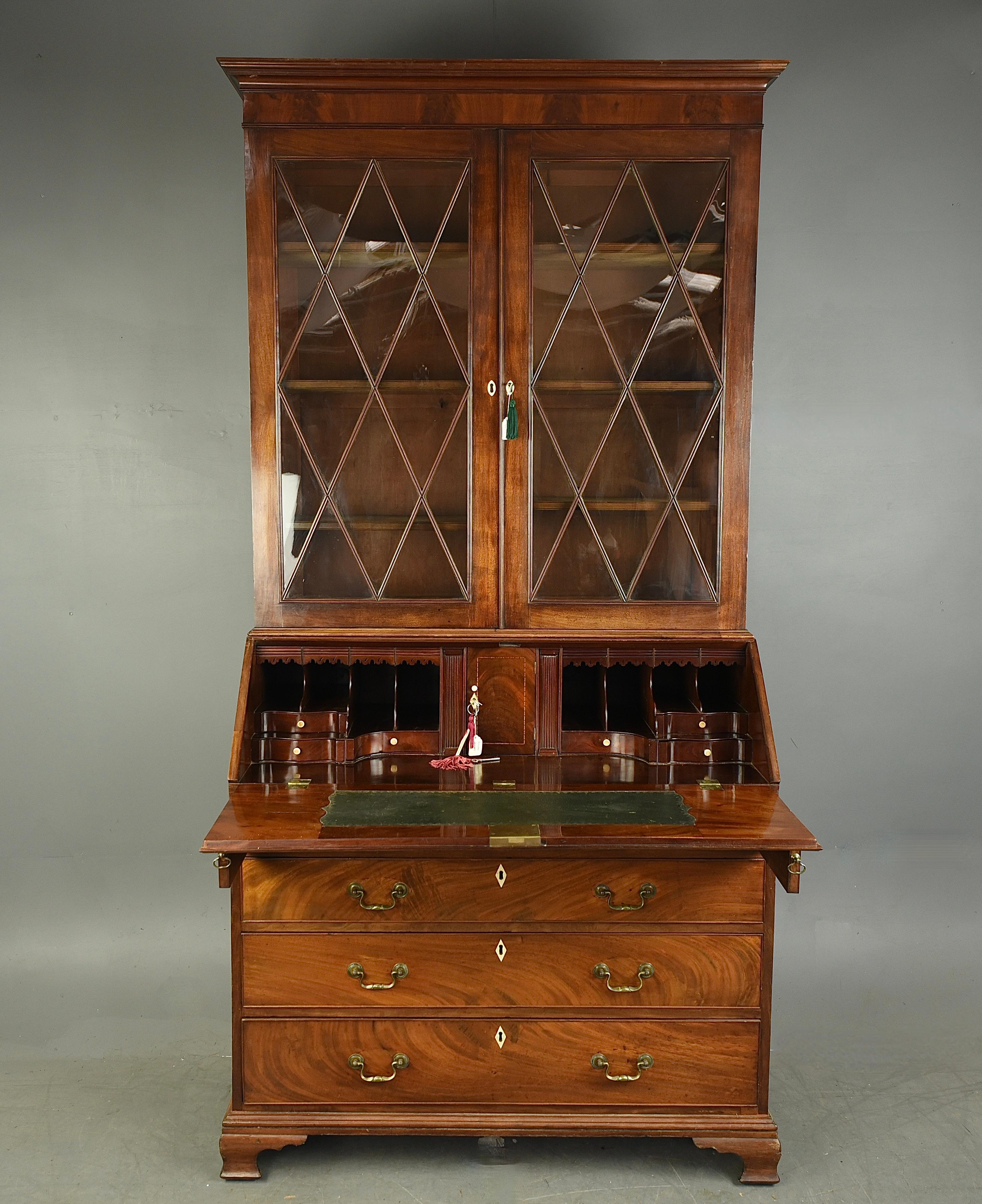 A very hansom early Georgian mahogany bureau bookcase .
The top has 6 fully adjustable shelves and quality glazed doors .
The bureau has a wonderful fitted interior with serpentine drawers and 6 secret drawers in total and a central cupboard and a