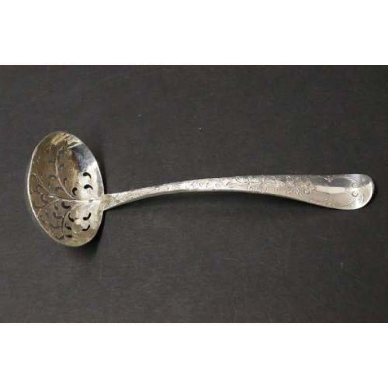A fine Georgian silver engraved sugar spoon.

A superb and highly decorative silver sugar spoon hallmarked London 1799 – 80. The finely pierced bowl is decorated with raised and engraved work in the form of a veined leaf. The shaped handle is