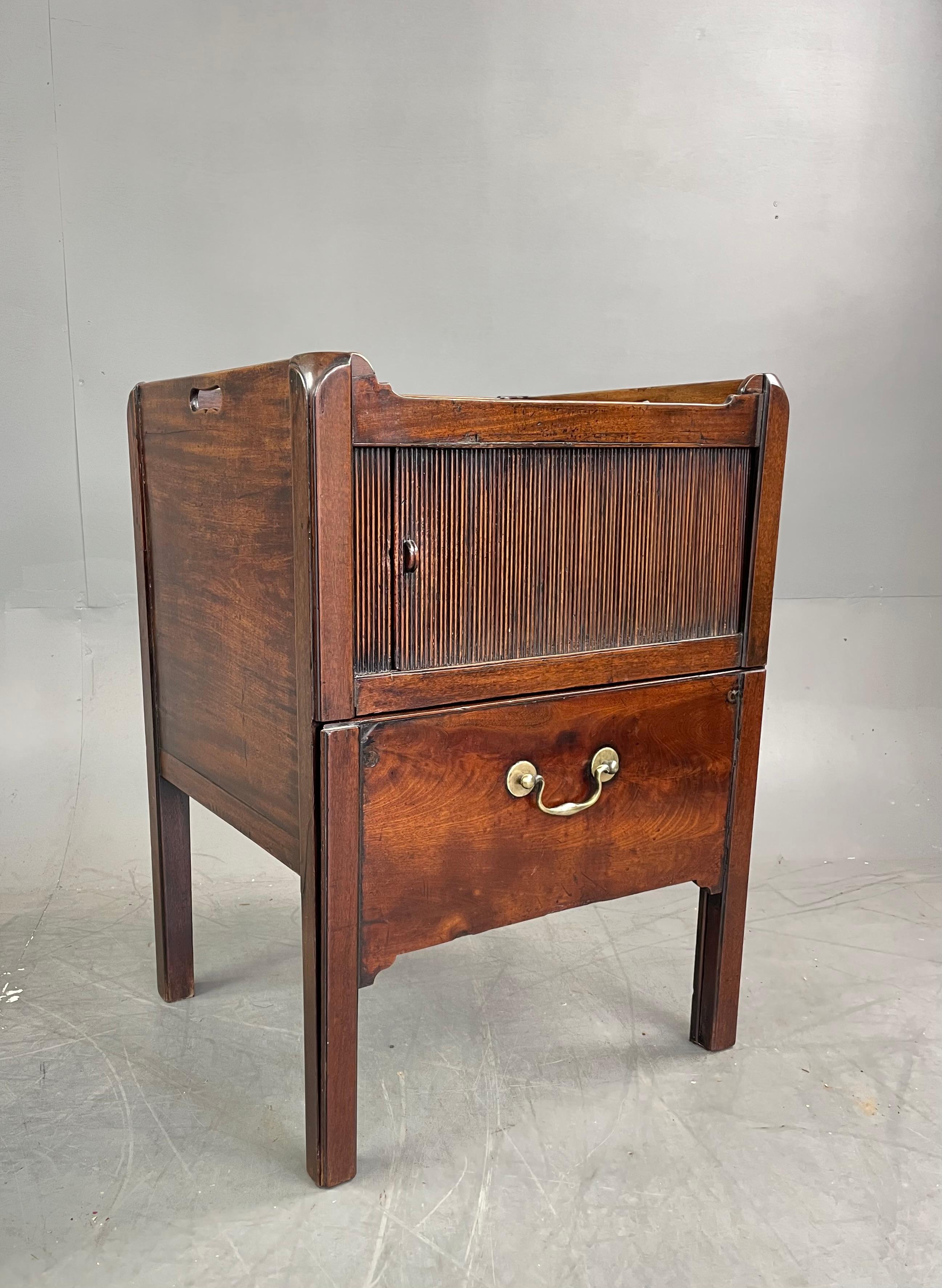 A wonderful George 111 mahogany tray top tambour front Georgian bedside cabinet .
The cabinet is constructed of the finest mahogany of the time with a wonderful colour and grain ,This suburb cabinet has a sliding tambour front and a shallow pull out