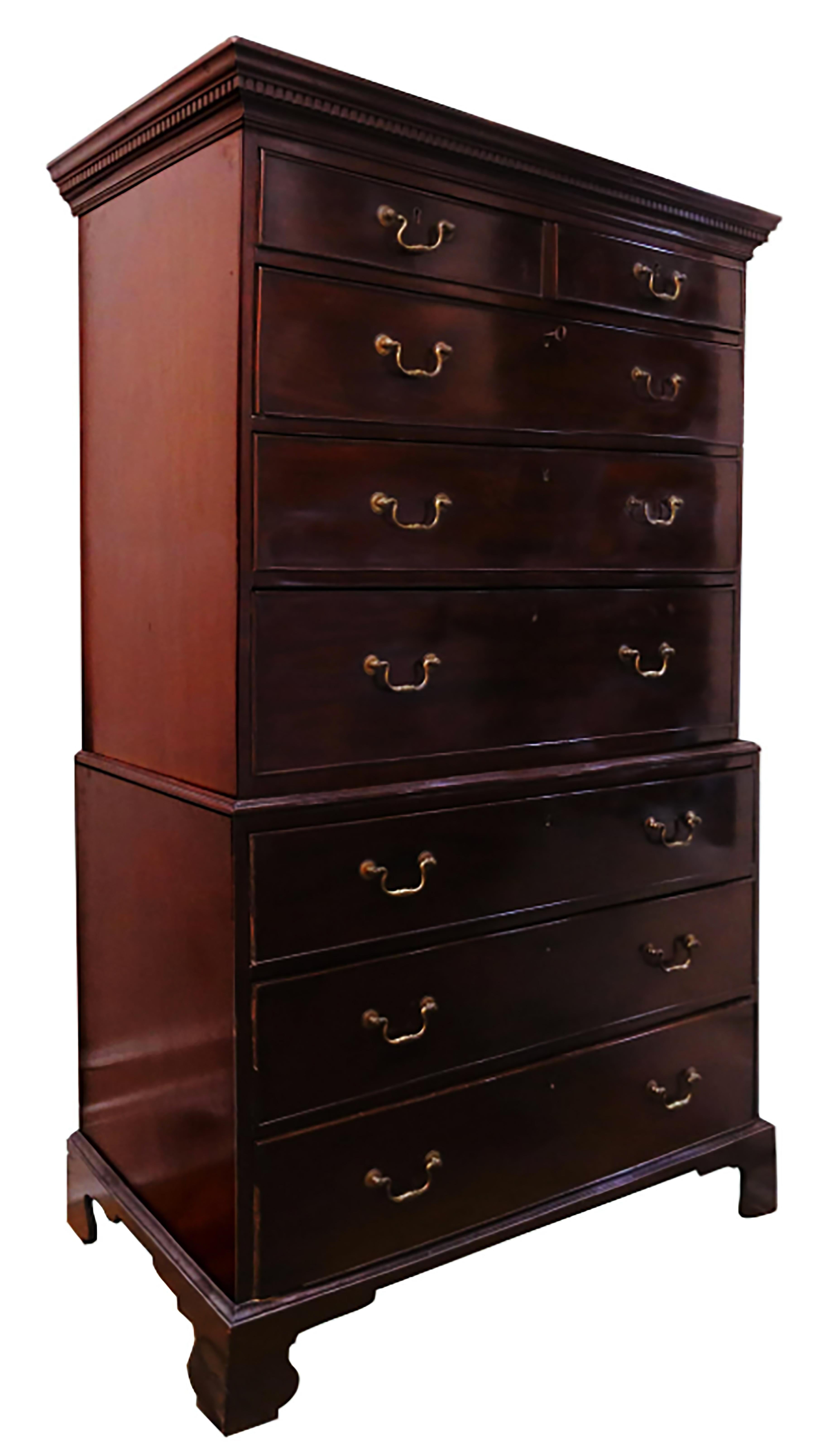 A handsome, richly colored chest on chest in Cuban mahogany. The lower case rests on bracket feet with three graduated drawers with cock beaded edges on both upper and lower cases. The commodious drawers are composed of dovetailed pine secondary