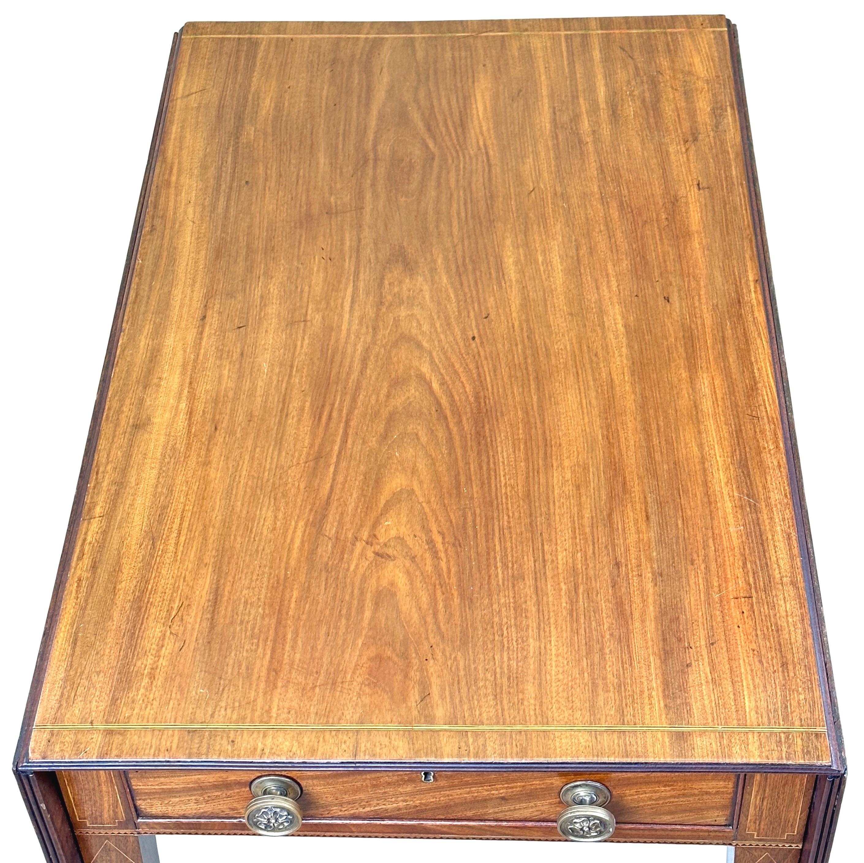 A very good quality late 18th century, Georgian Sheraton period, mahogany Pembroke table, having well figured two flap top with inlaid strung decoration, over one frieze drawer, opposed by false drawer to reverse, raised on elegant square tapered