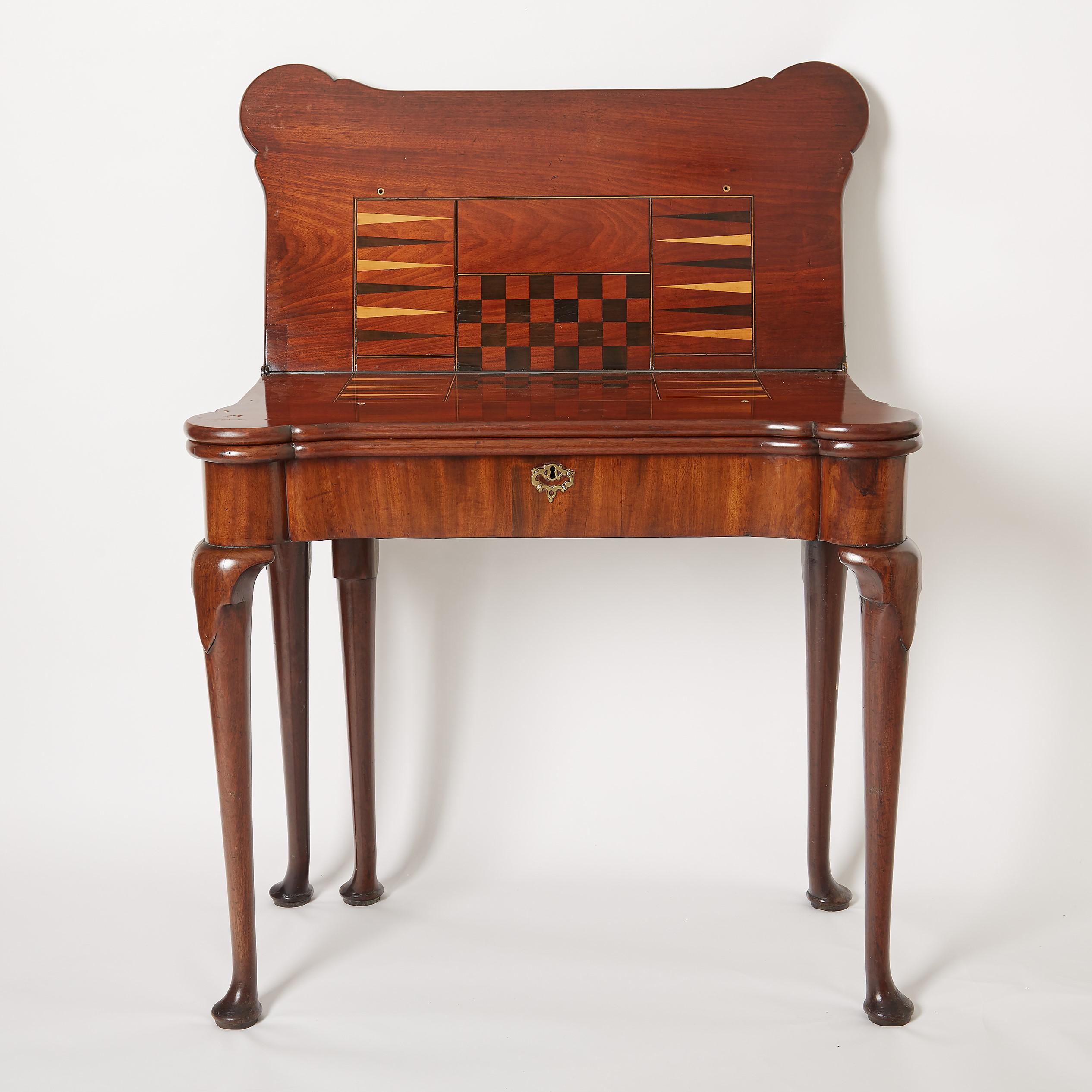 18th century Georgian mahogany triple top games table with ebony and satinwood inlay. Circa 1740.