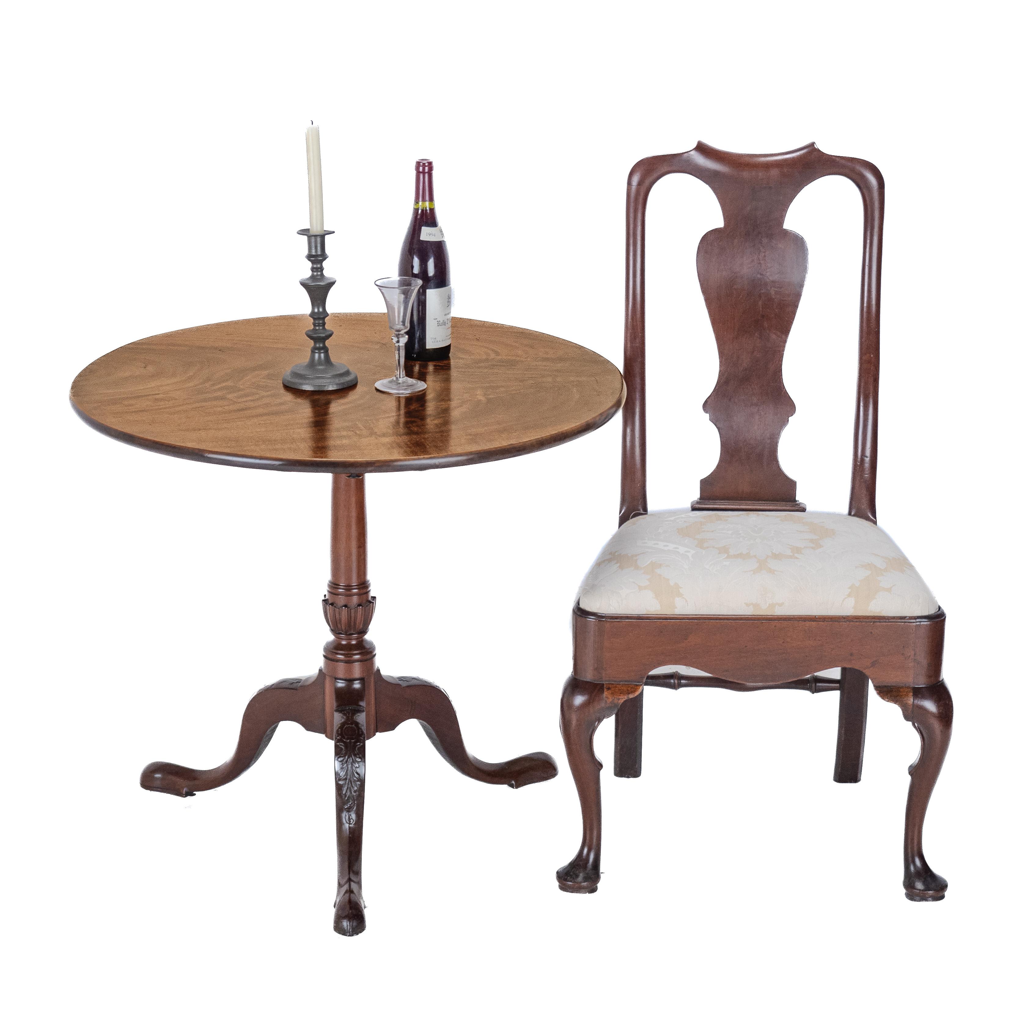 A George III period, mahogany tripod supper table, dating from the late 18th century. This quality table features a beautifully figured, single piece, solid mahogany top. Supported by a baluster stem, raised on a tripod of carved cabriole legs.

An