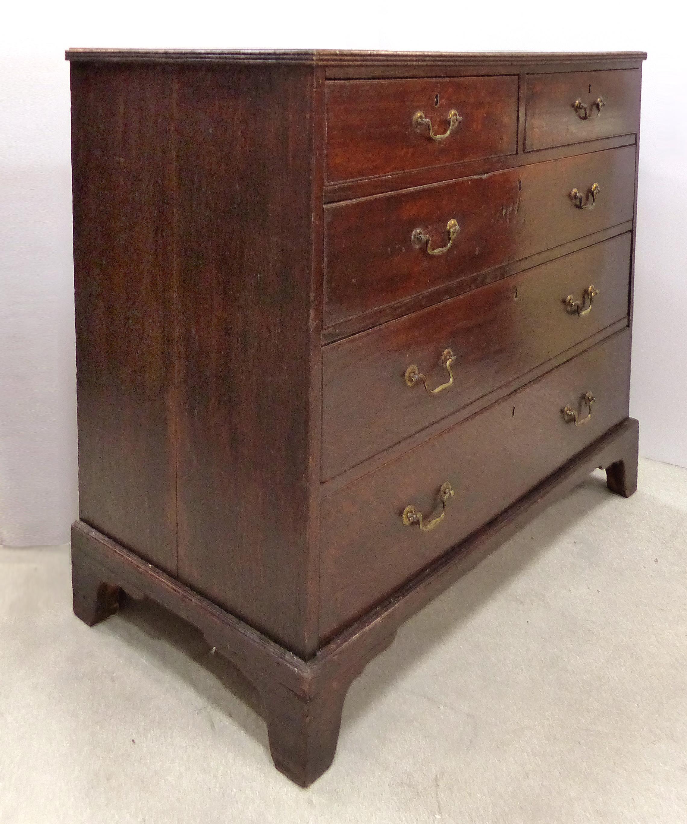 18th Century Georgian Oak Chest of Drawers with Swan Neck Brass Pulls

Offered for sale is an 18th century Georgian oak chest of drawers with two short drawers over three long graduated drawers. The cabinet retains the original brass swan neck