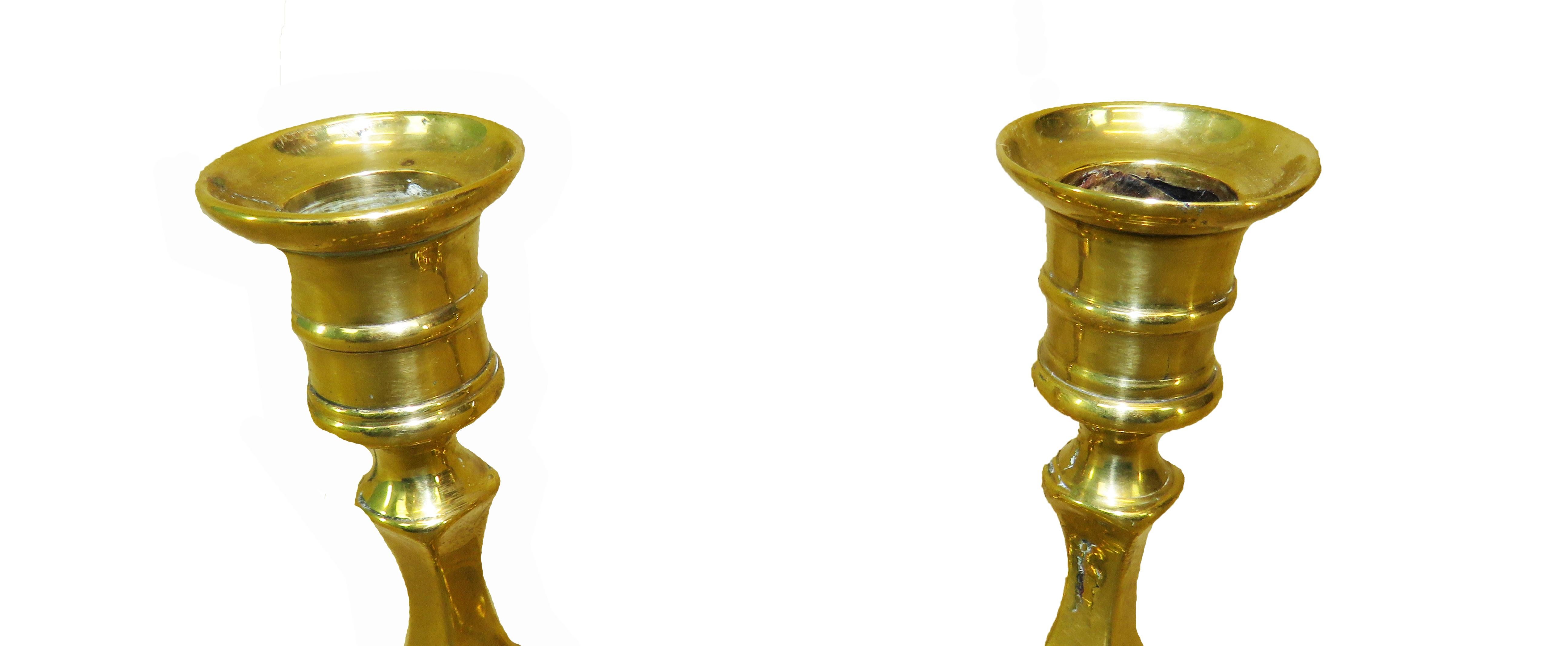 A very attractive pair of 18th century George
II period brass candlesticks having elegant
Petal bases.
 