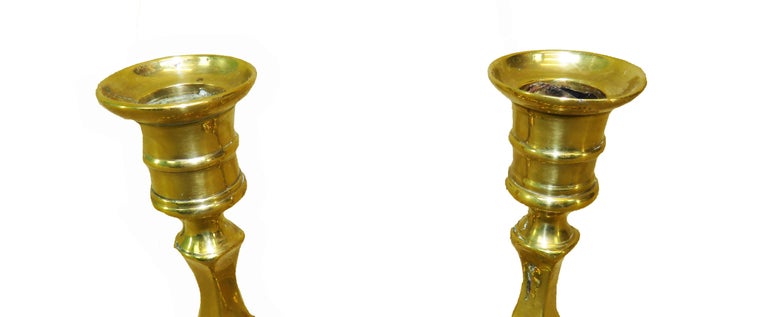 A very attractive pair of 18th century George
II period brass candlesticks having elegant
Petal bases.
 