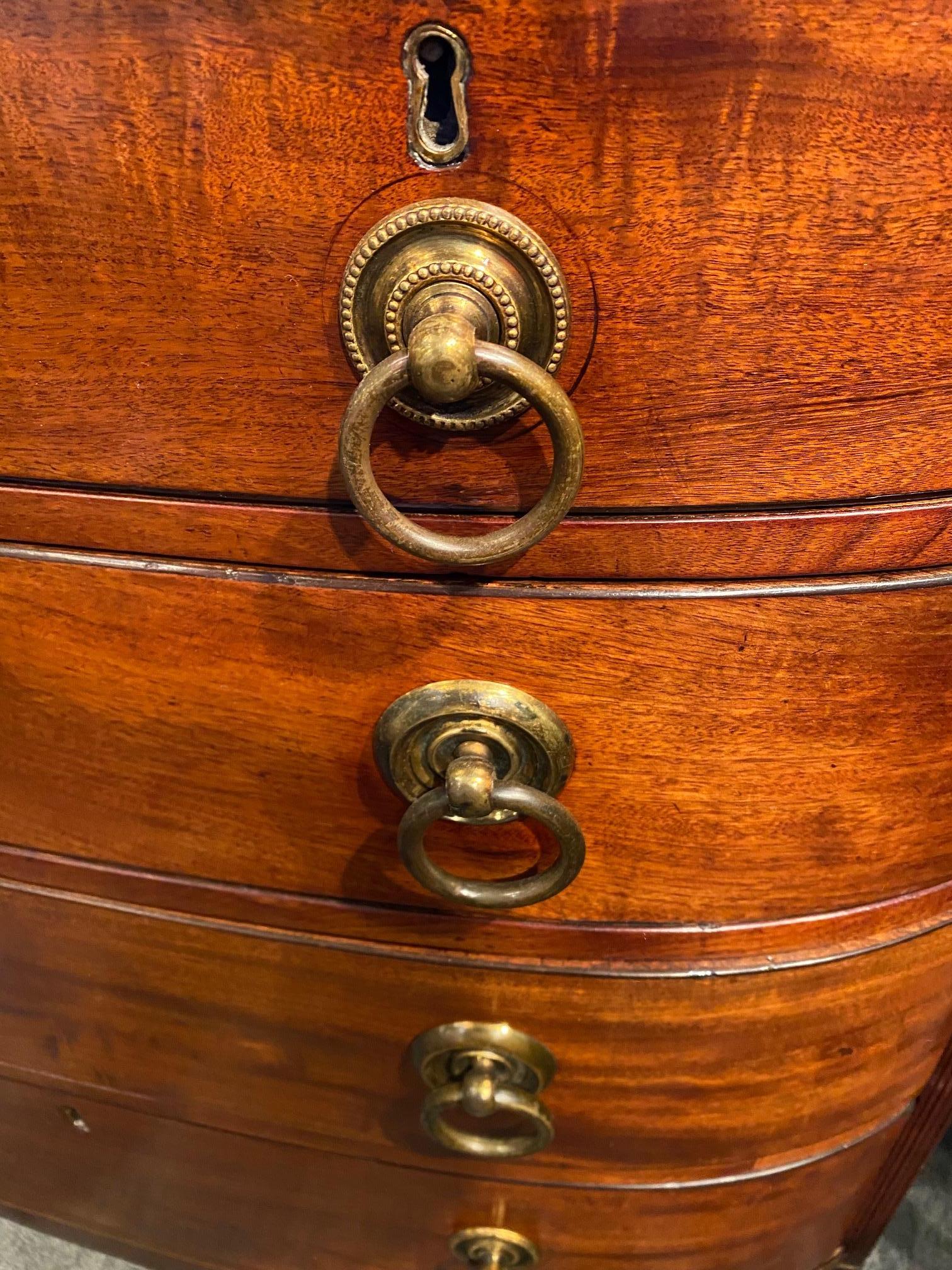 18th century Georgian period mahogany bow front chest of drawers with bracket feet.




