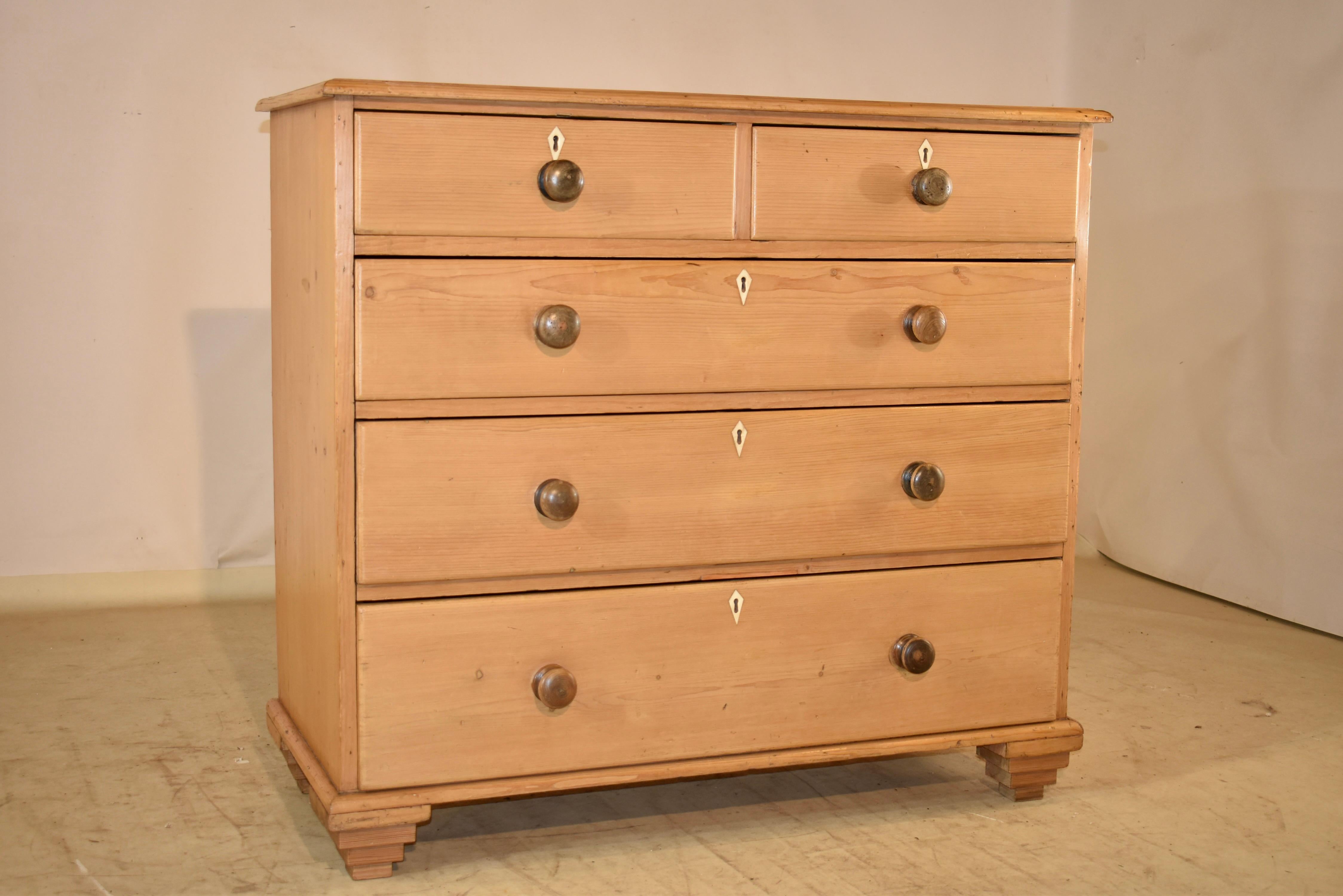 Period Georgian 18th century pine chest of drawers from England.  The top has a beveled edge around a single plank top, following down to single plank sides as well.  The front of the case has two drawers over three drawer configuration, all with
