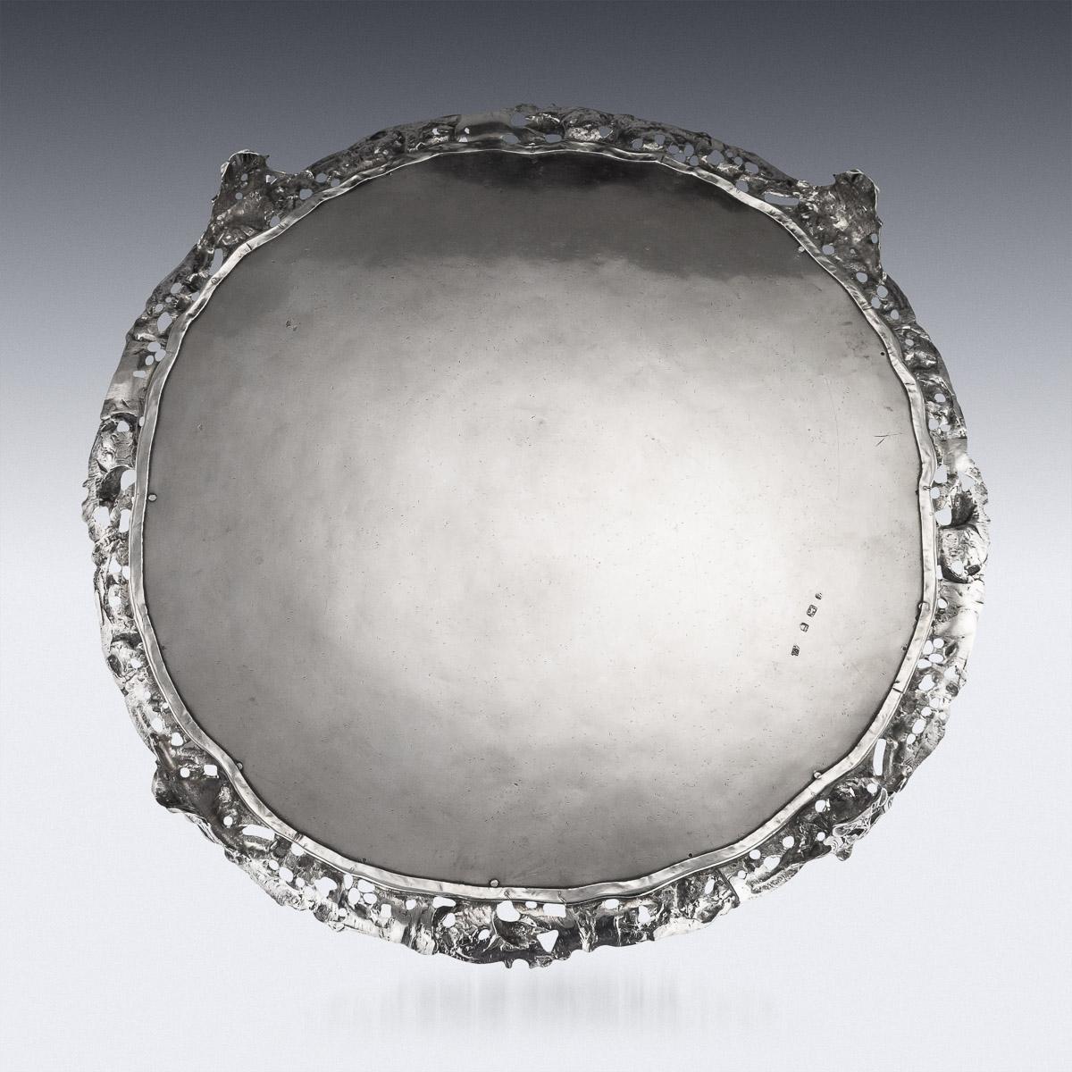 Antique mid-18th century Georgian rare and exceptional solid silver salver with cast border, impressively large size and extremely heavy gauge, of shaped-circular form on four impressive cast scroll feet, with applied cast border depicting female
