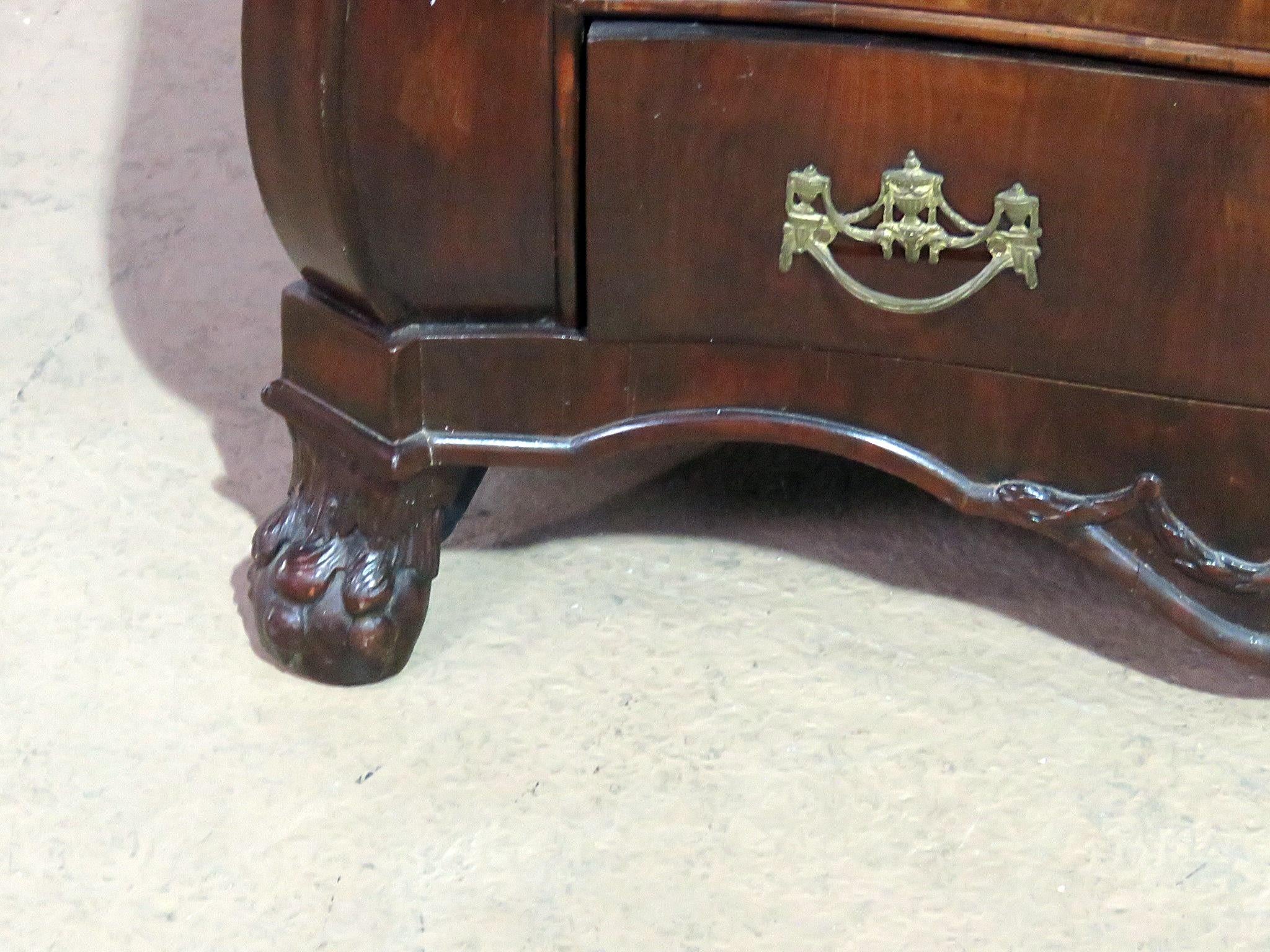 18thC Dutch bombe four-drawer commode with ball and claw feet.