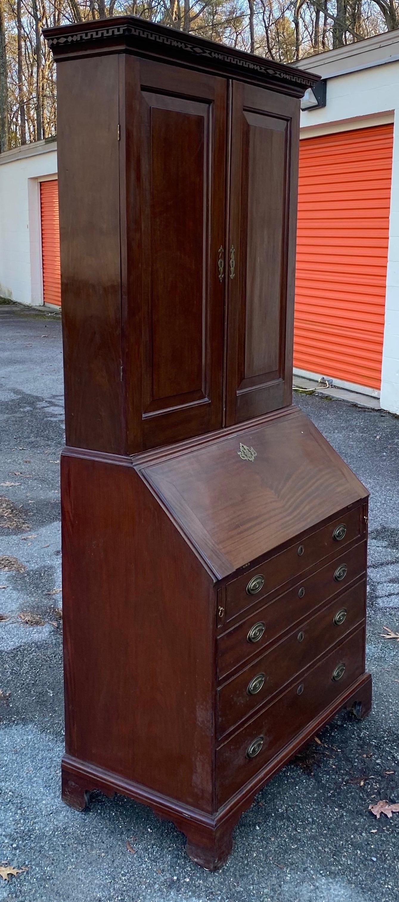 18th century Georgian walnut secretary bookcase. Blind paneled doors, bracket feet.