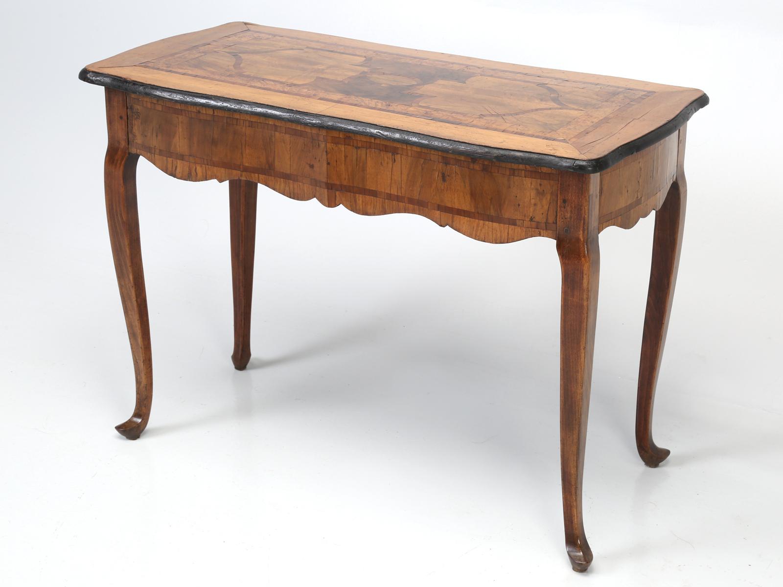 Exceptional 18th century South German walnut and fruitwood parquetry console or sofa table. Having a serpentine body and top, with intricate inlays, ebonized edge, and wonderful aged patina.
Several mends and previous restorations, Please see photo