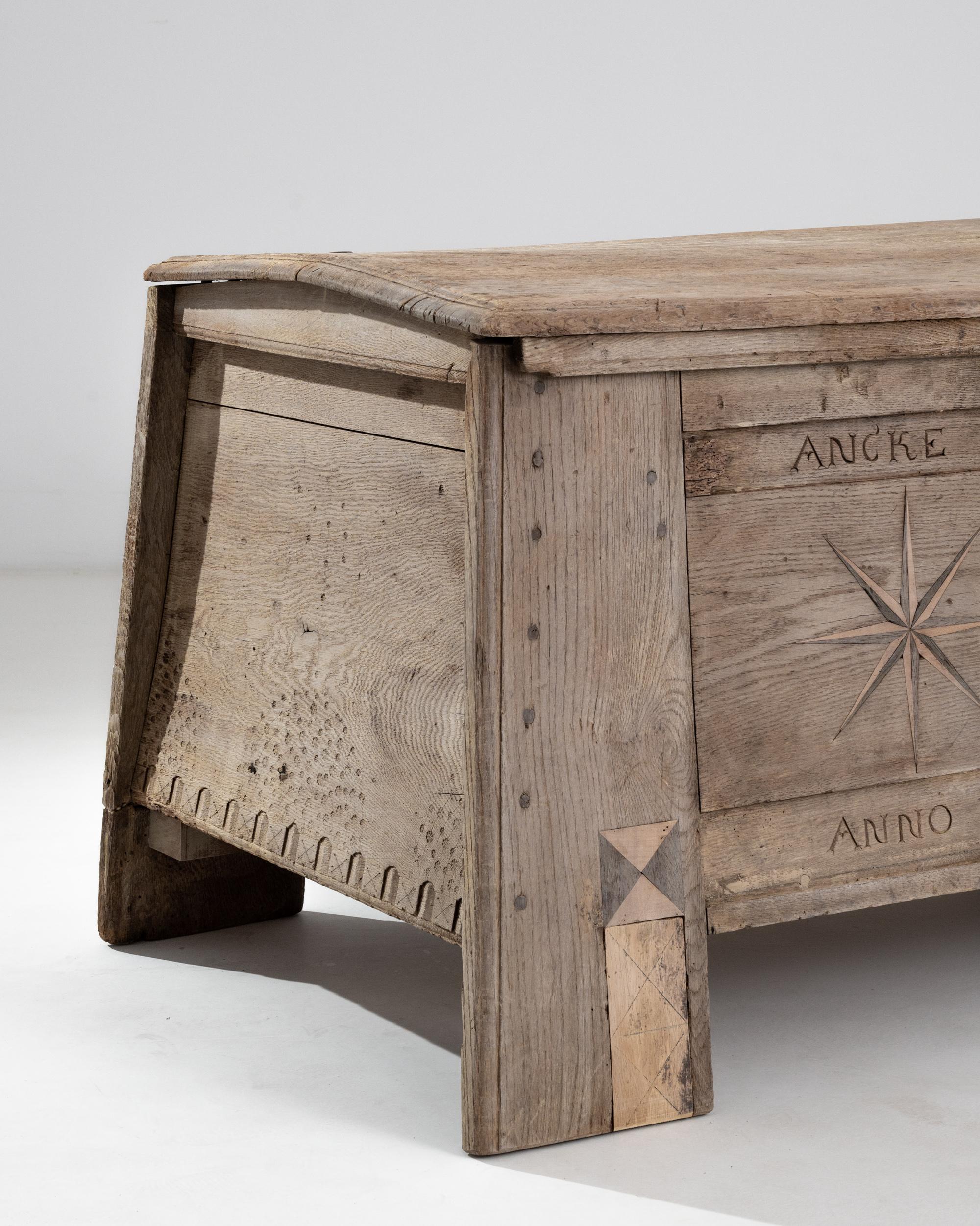 This impressive antique trunk is carved with the year of its construction, 1707 along with the name of its former owner, “Ancke Eggers”. Wide plank legs playfully juxtapose against the slightly cambered sides, adding fluidity to its robust anatomy.
