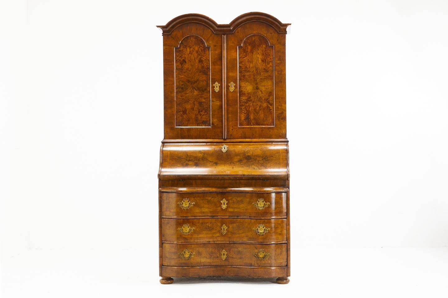 18th century German double dome walnut bureau cabinet with serpentine base, figured walnut panels and original metal work.