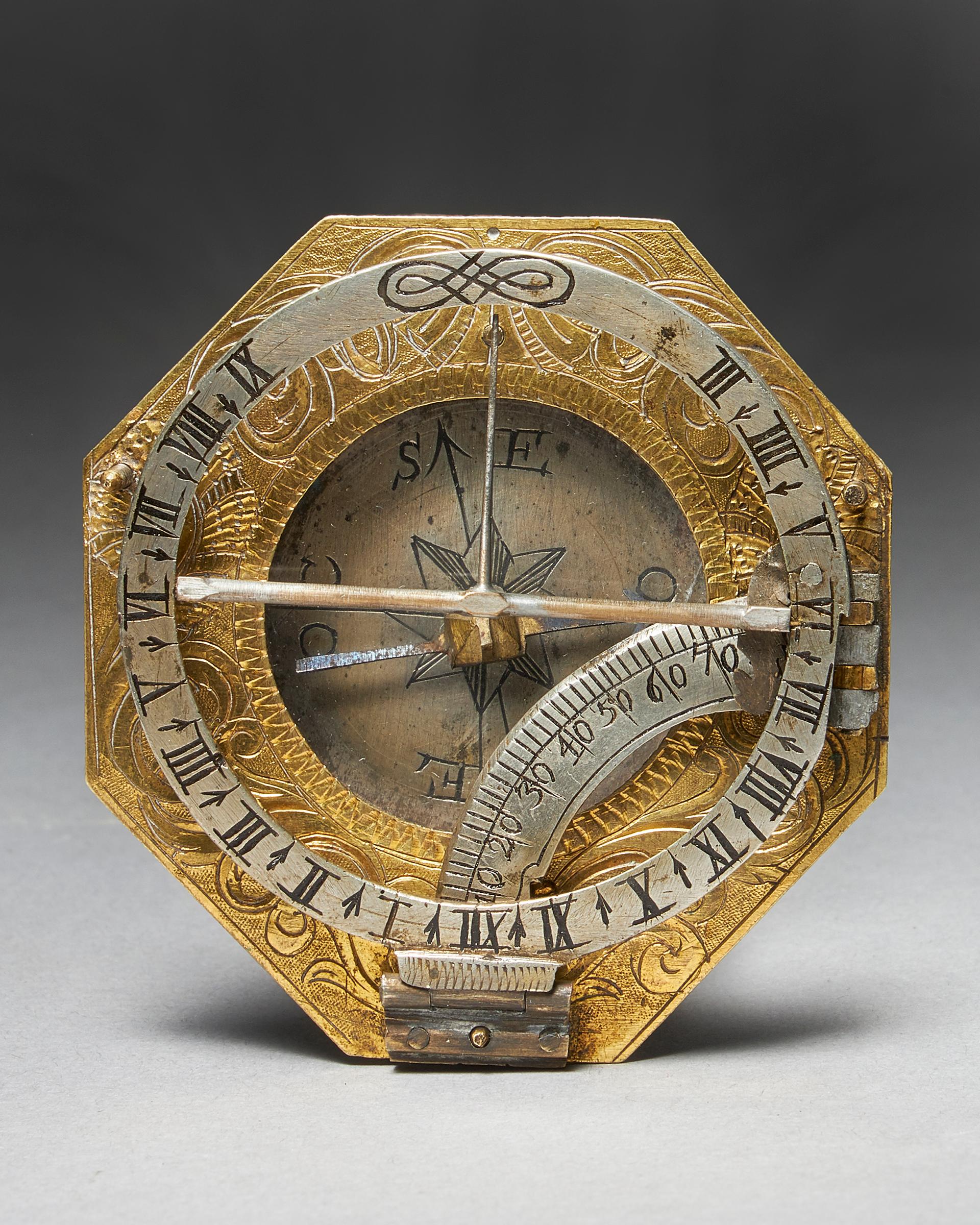 From the first quarter of the 18th century - a German brass equinoctial pocket sundial by Ludwig Theodor Muller, Augsburg. The sundial consists of three parts: a richly engraved octagonally shaped gilt brass base, which holds a recessed compass with