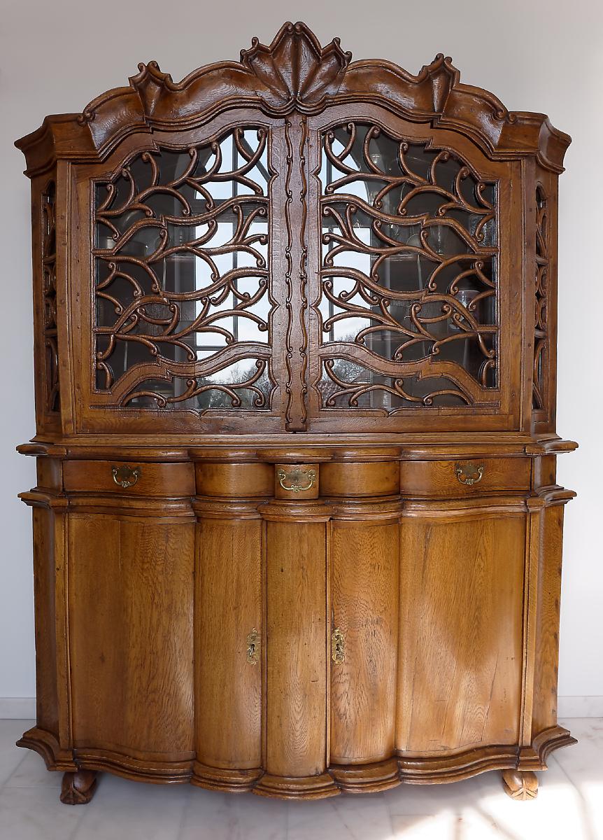 Very unusual 18th century German farmhouse kitchen cabinet. The two upper doors with carved ornamental floral decoration in the form of tree branches. This cabinet was probably a wedding furniture with the stylized tree, symbolizing fertility; there