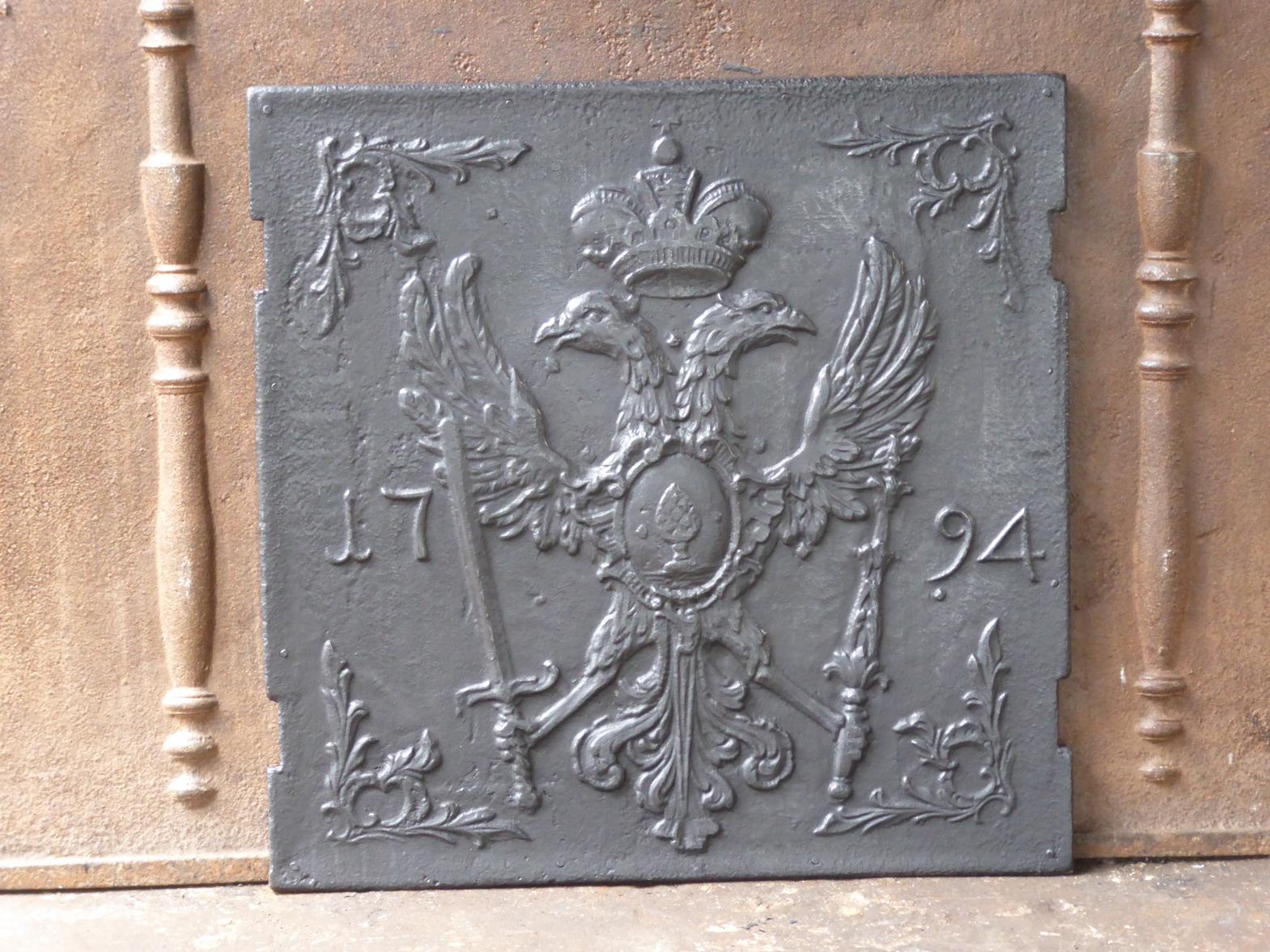 18th century German Louis XV fireback with a coat of arms. The date of production, 1794, is also cast in the fireback.

 The fireback is made of cast iron and has a black / pewter patina. The condition is good, no cracks.







