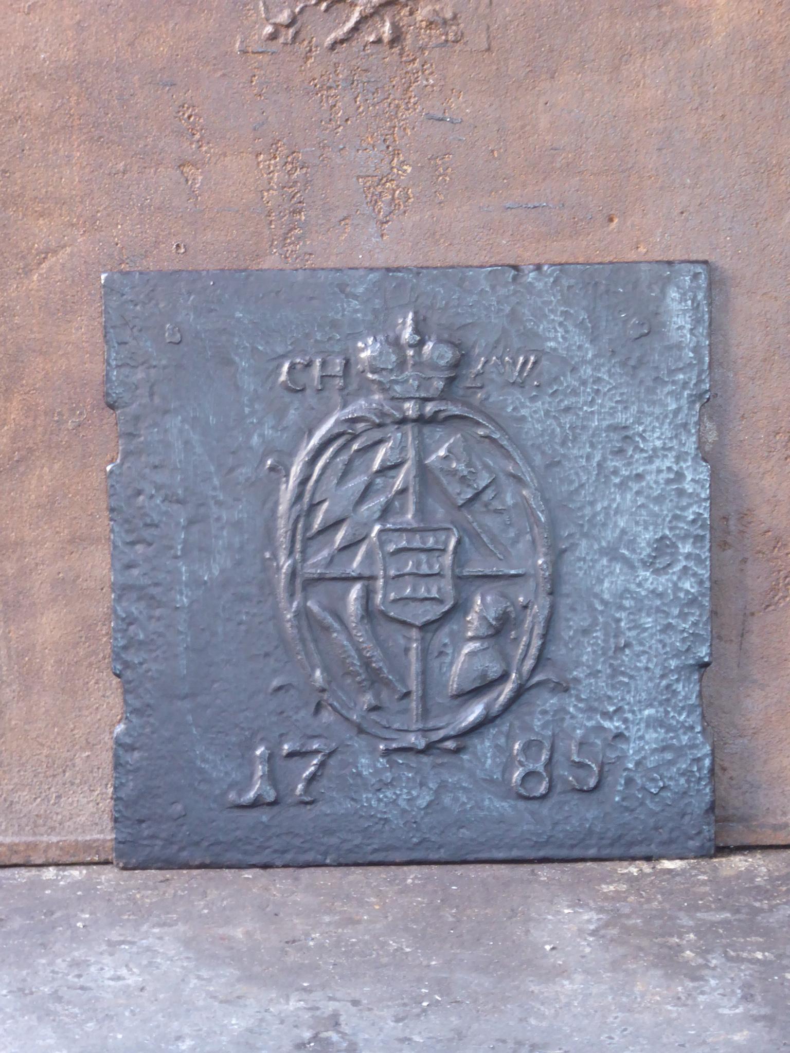 18th century German Louis XV fireback with a coat of arms. The date of production, 1785, is also cast in the fireback.

 The fireback is made of cast iron and has a black / pewter patina. The condition is good, no cracks.







