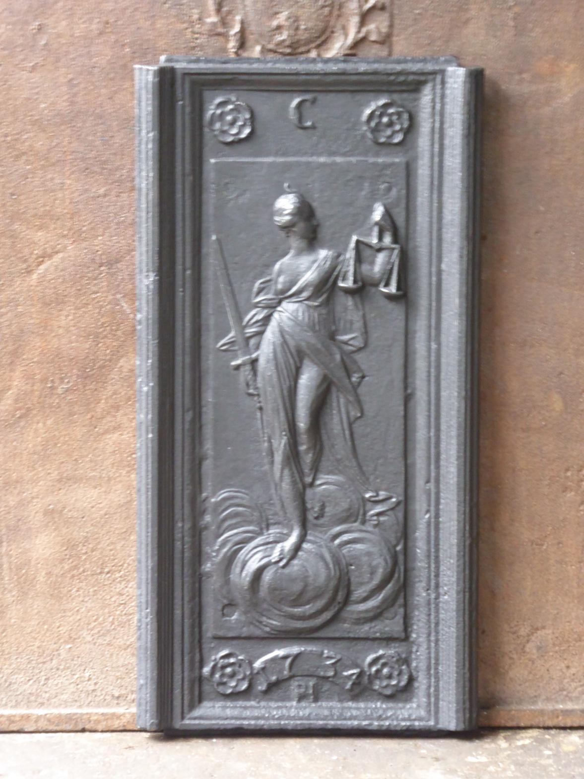 18th century German Louis XV fireback with Justice. The personification of justice balancing the scales of truth and fairness dates back to the Goddess Maat, and later Isis, of ancient Egypt.

The fireback is made of cast iron and has a black /