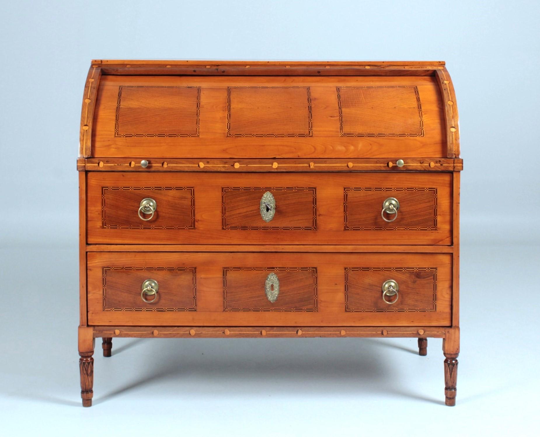 Louis XVI cylinder secretary

Bavaria
Cherry, walnut
Louis XVI circa 1790

Dimensions: H x W x D: 111 x 119 x 60 cm

Description:
Well proportioned writing desk standing on carved round feet.

The bureau consists of one piece, but is visually