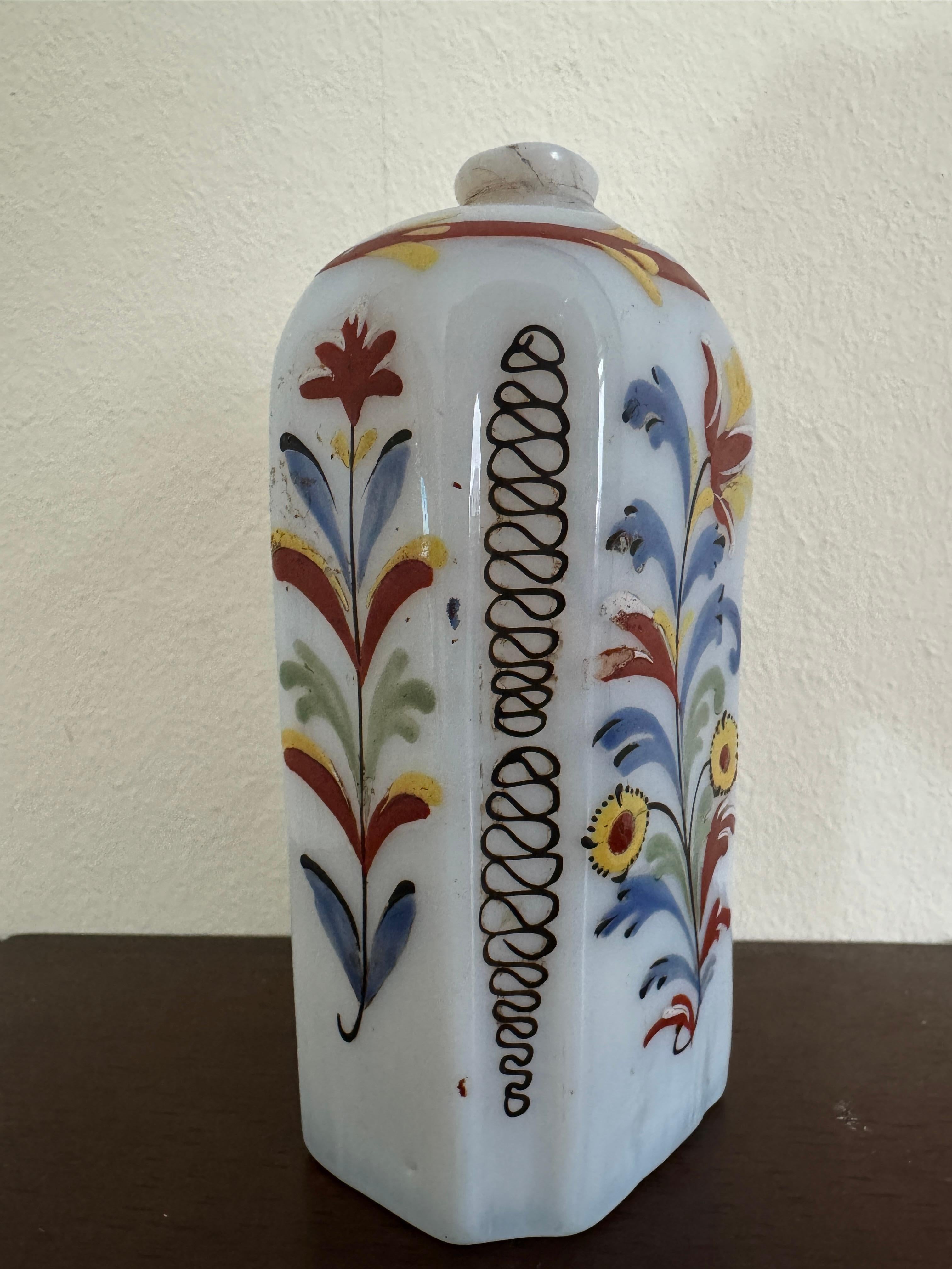 An 18th Century German, or possibly Bohemian, Milk / Opalescent Glass Bottle. Flattened octagonal shape. Hand decorated with yellow and red flowers.

12.5cm / 5