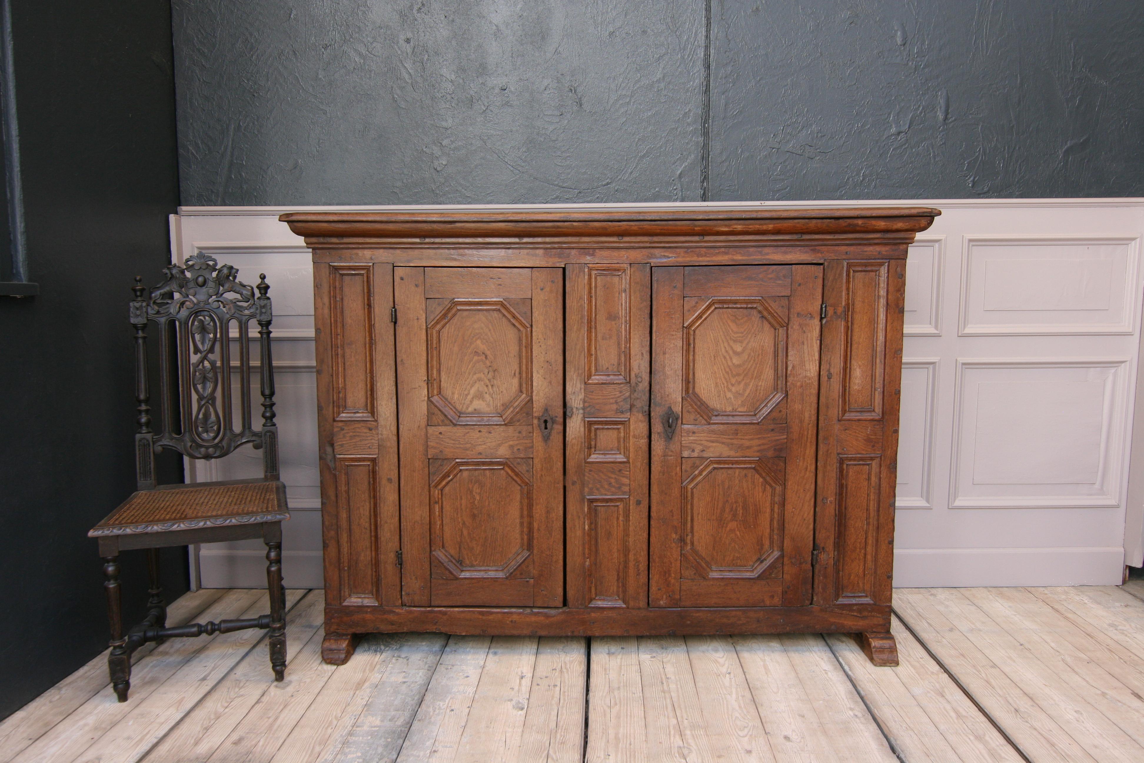 Rustic German sideboard or credenza, made of solid oak. Probably from the Westphalia region circa 1780.

Dimensions: 
123 cm high / 48.42 inch high,
171 cm wide / 67.32 inch wide,
51 cm deep / 20.08 inch deep.