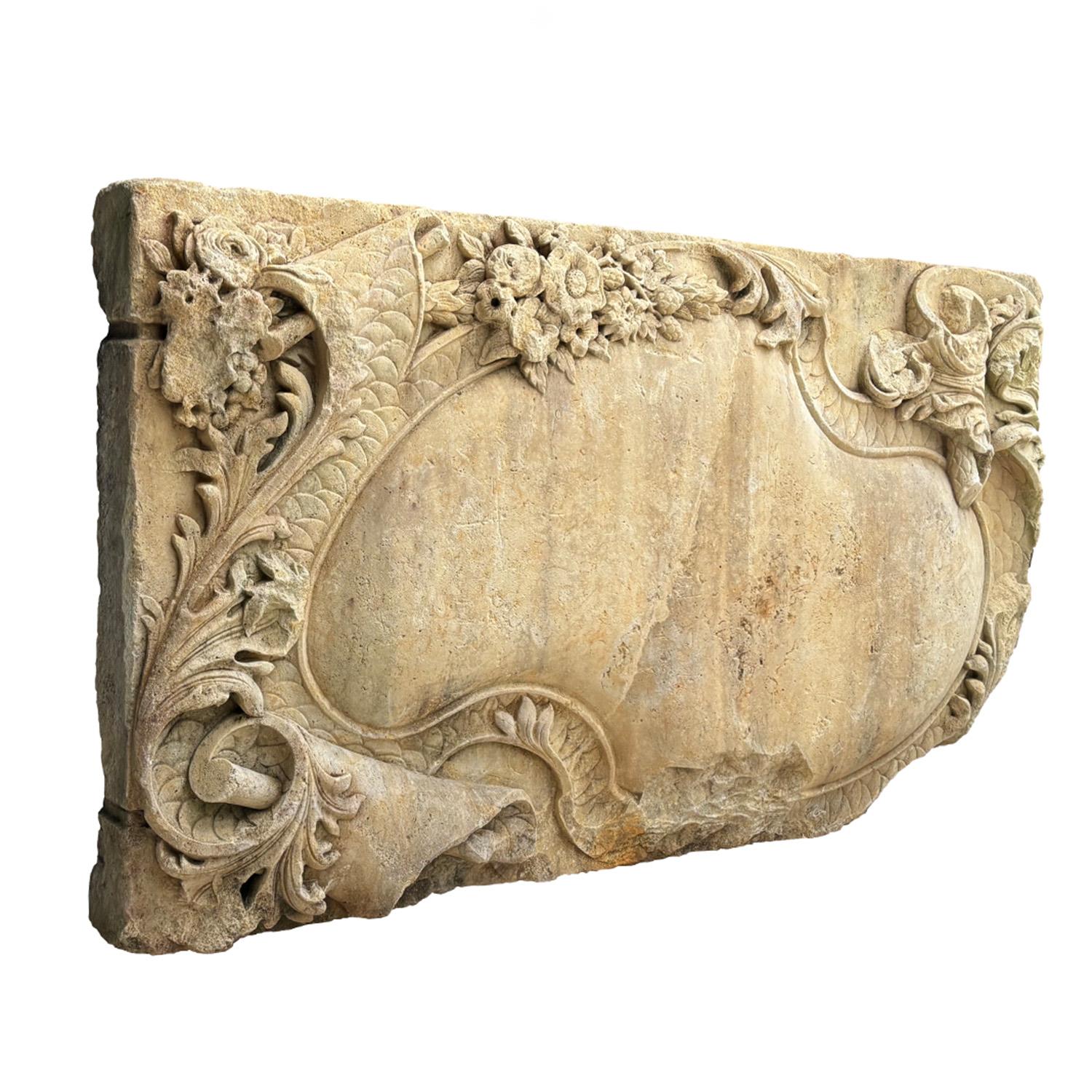 A rectangular, antique pair of similar German Baroque wall reliefs with centered cartouche, made of hand carved sandstone in good condition. The large detailed panels are particularized by Rocaille ornaments in bas relief. Minor fading, scratches 