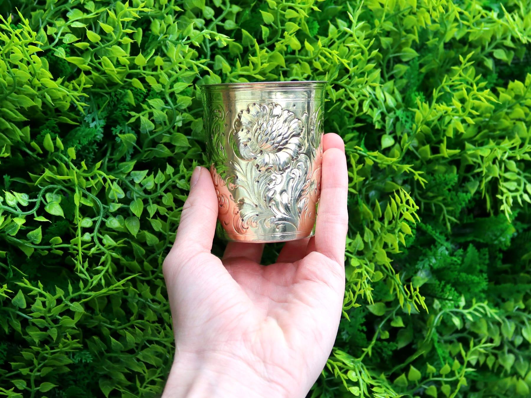 An exceptional, fine and impressive 18th century, German silver gilt beaker made in Hanau; part of our continental silverware collection.

This exceptional antique German beaker has a tapering cylindrical form.

The surface of this antique