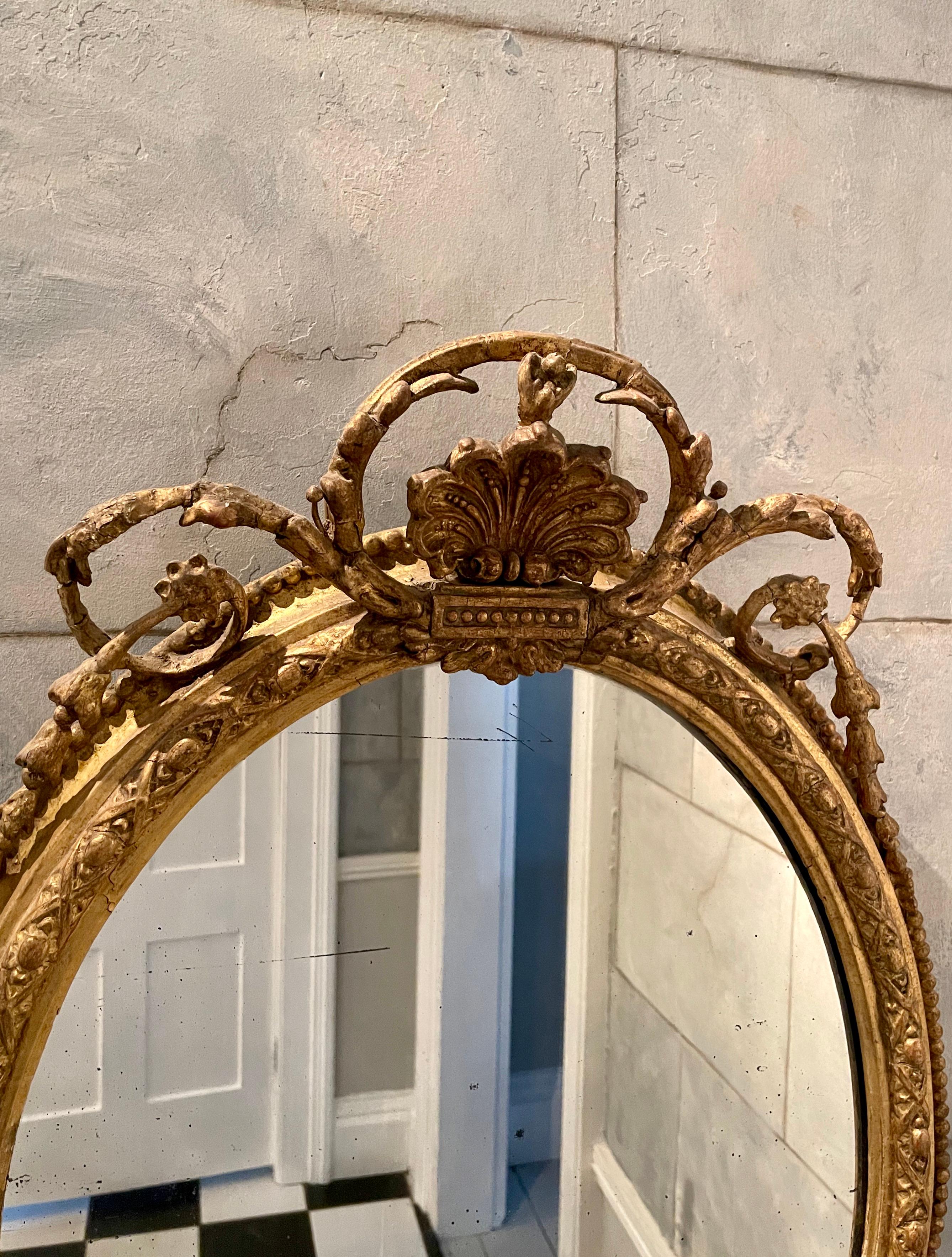 Hand-Crafted 18th Century Gilded Oval Girandole Mirror with Triple Candelabra For Sale