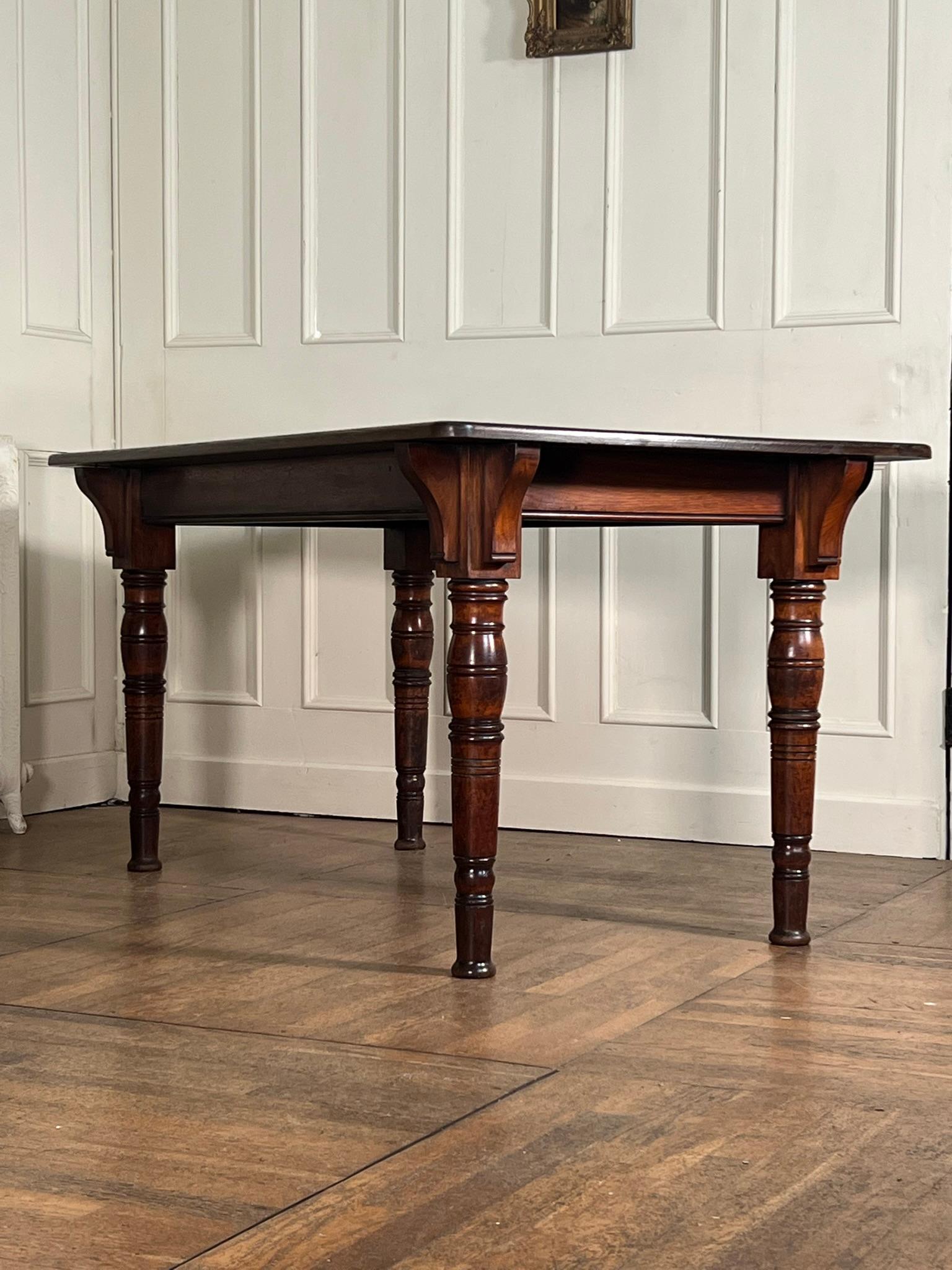 19th century Gillows of Lancaster table.

Mahogany table base stamped with the makers mark and model number L4953 with a later oak plank top.

This would have originally been a section of a larger country house dining table.

Well-turned legs and