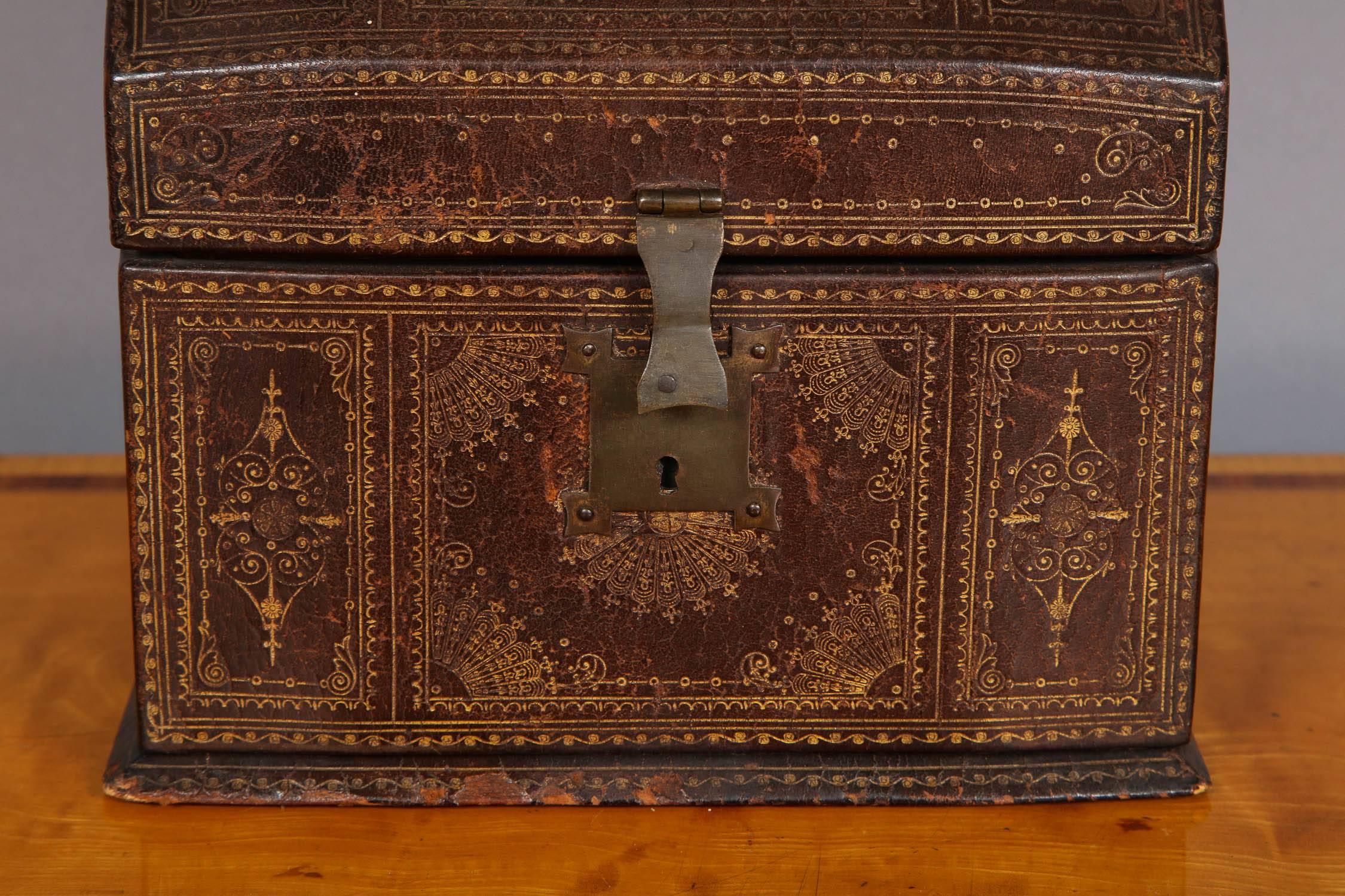 Fine 18th century French gilt tooled leather box retaining original wrought iron hardware, the interior now lined in green silk for use as a stationary/desk box.