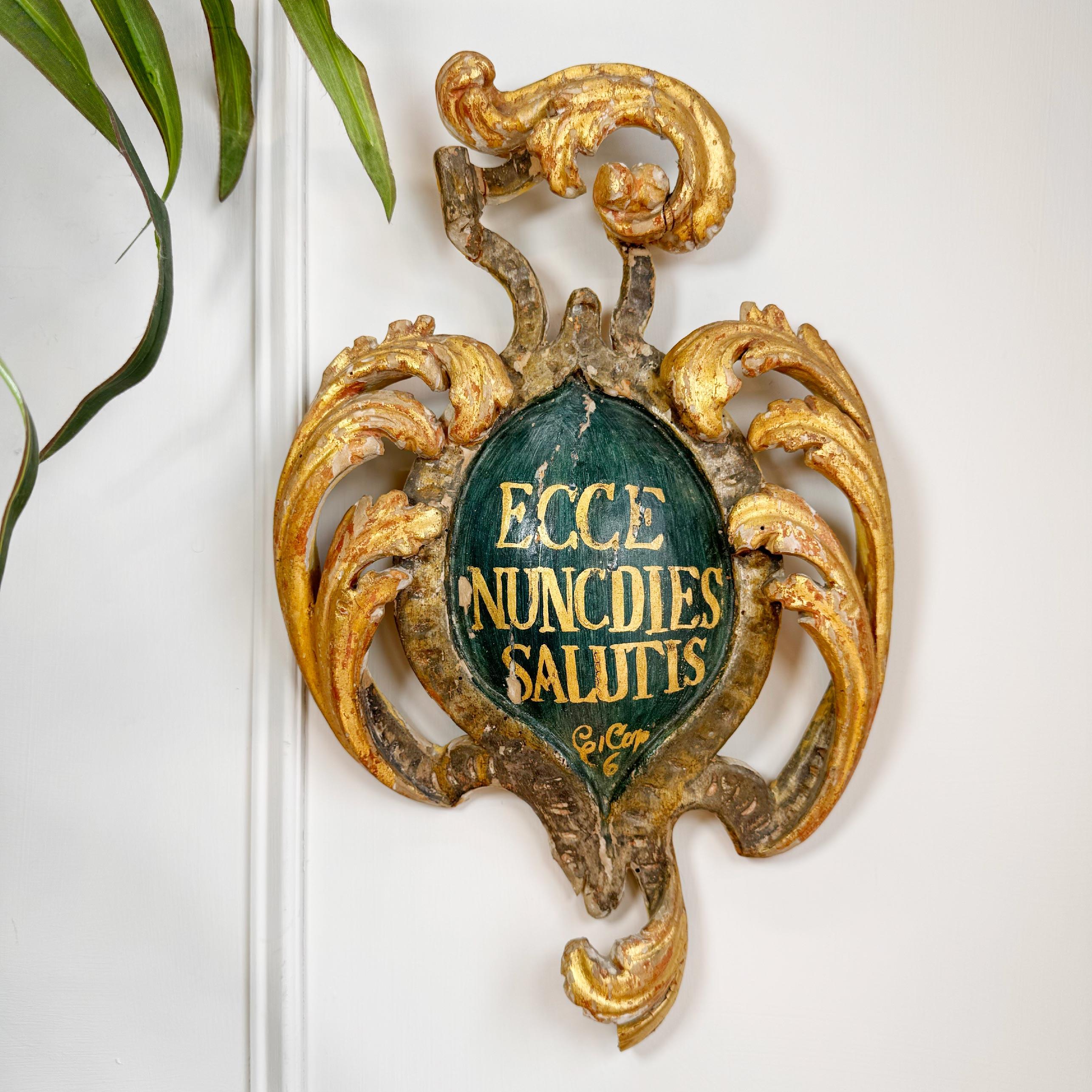 Stunning 18th century carved wooden religious shield, Italian early 1700’s, in gilt and green with the words ECCE NUNCDIES SALUTIS (This is the Day of Salvation) to the centre.

Historic repairs and small losses commensurate with age.



Height 40.5