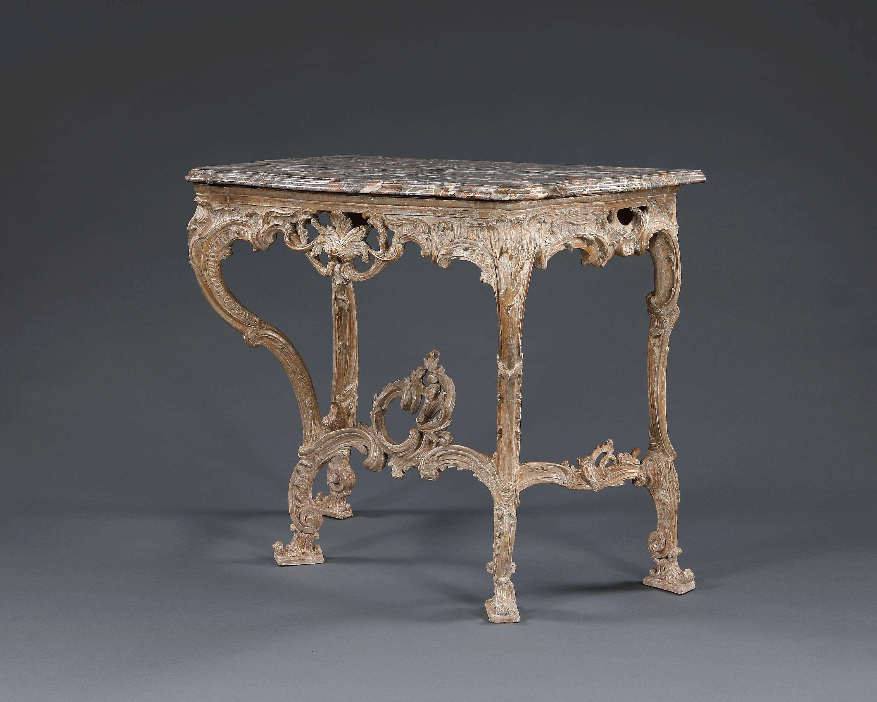 A fine quality serpentine fronted marble top giltwood console table, in the Rococo manner. English, circa 1760.