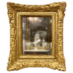 Specchio da parete in legno dorato del XVIII secolo, con bordo svasato e ornato