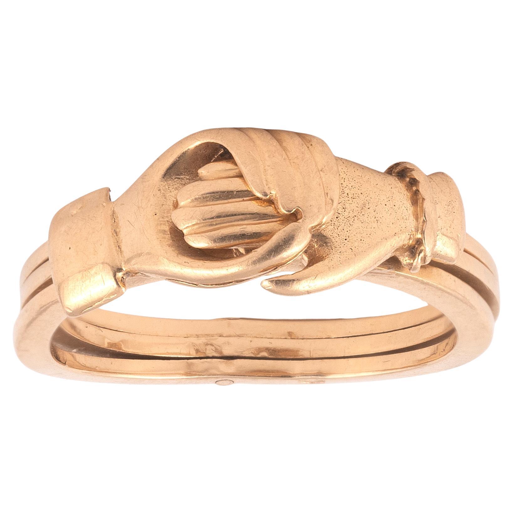 Comprising three mobile rings in 18K rose gold, one with a man's hand, one with a heart and one with a woman's hand. 
Gross weight: 5.80 gr.
Finger size: 7

Romance and love are conveyed to the fullest in this sumptuous ring composed of symbolically