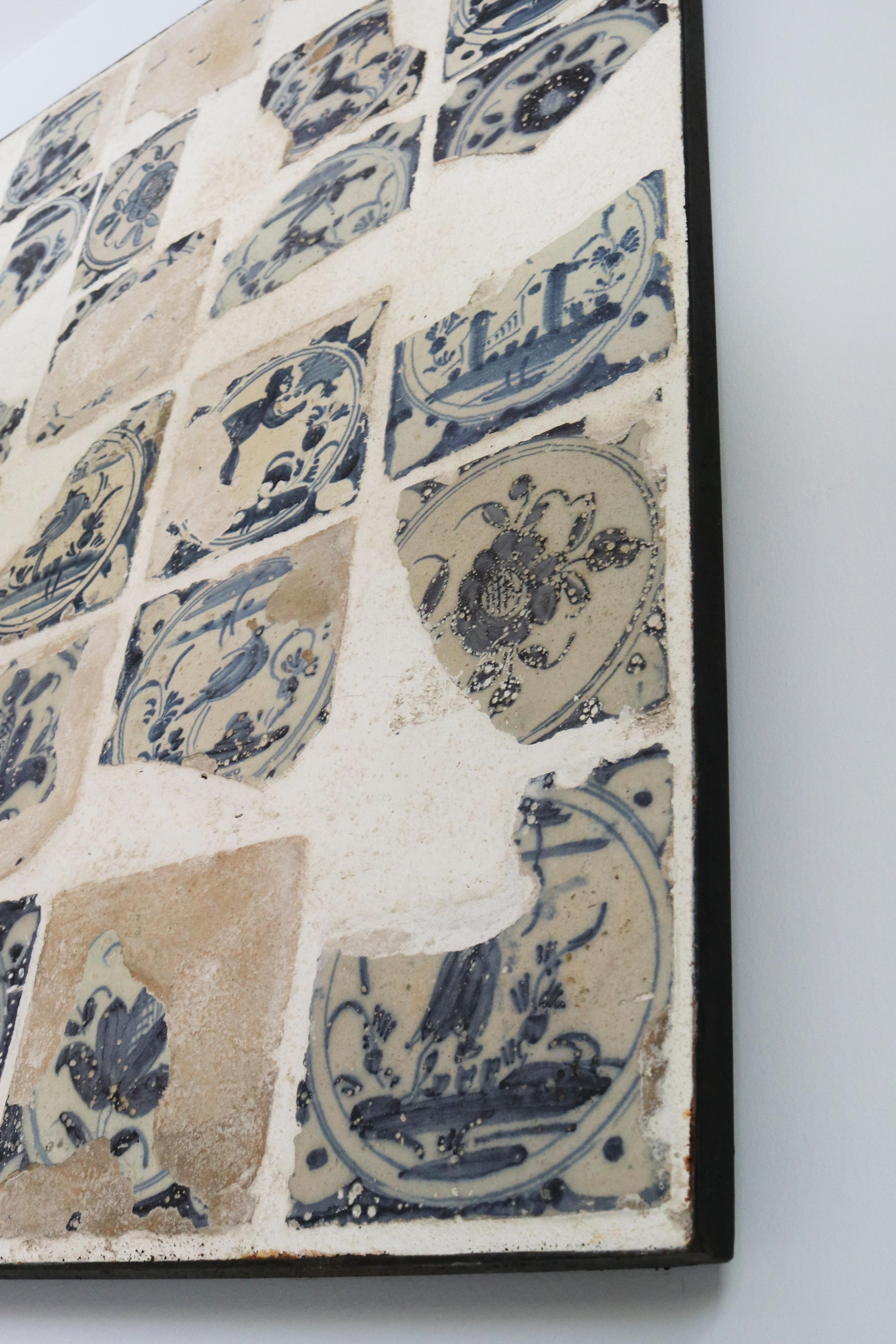 Hand-Painted 18th Century Glazed Ceramic Fragments Arranged on an Iron Framed Panel For Sale
