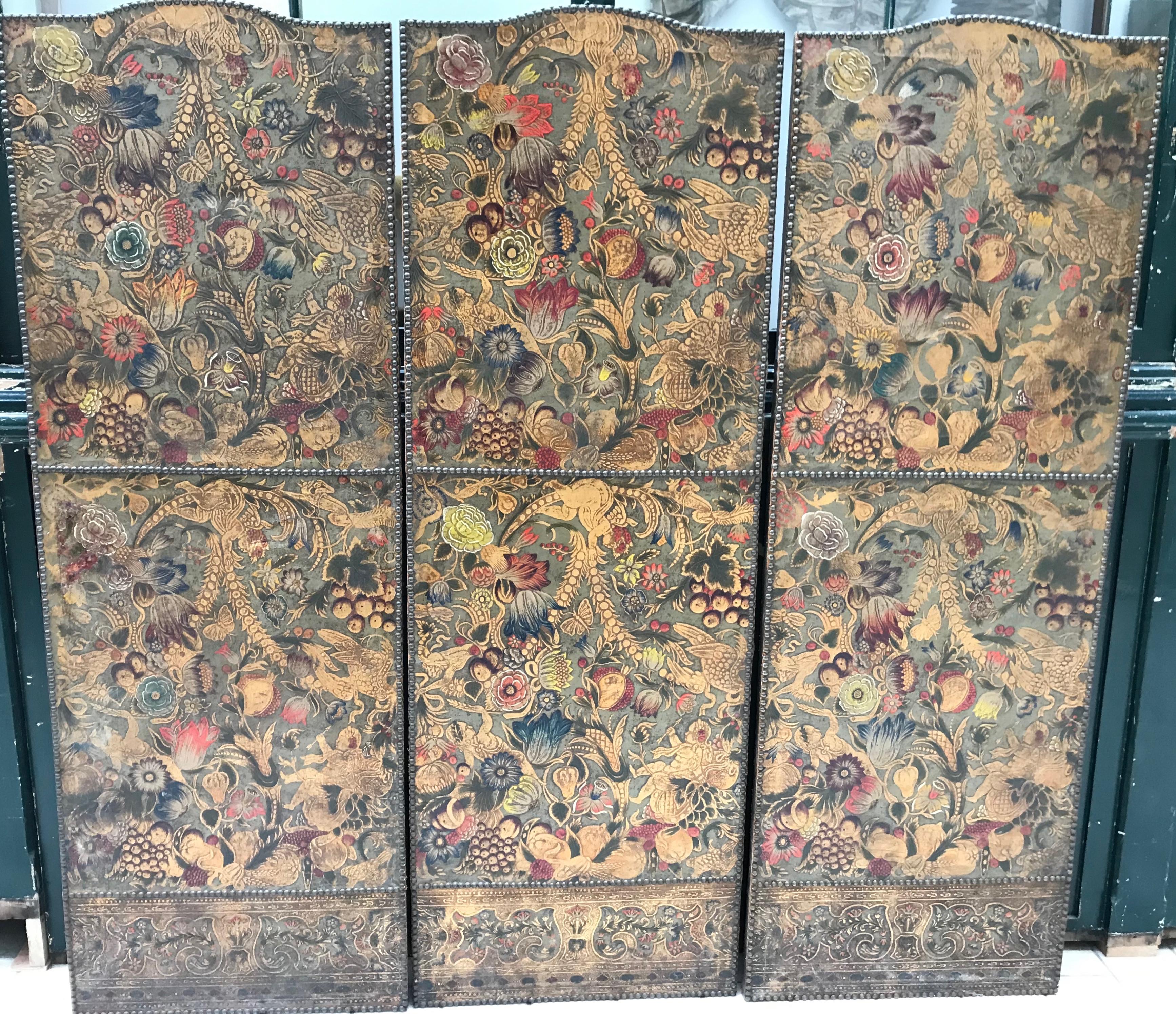 Three sensational 18th century Dutch panels painted on hand woven linen in blue and white on a rich gold background.
On the reverse the panels retain the original embossed and hand painted cordovan leather with monkeys and putti figures frolicking