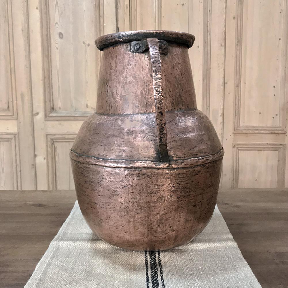 18th century hand-hammered French copper urn was hand-hammered entirely from copper,
circa 1780s.
Measures: 21 H x 20 W x 14 D.