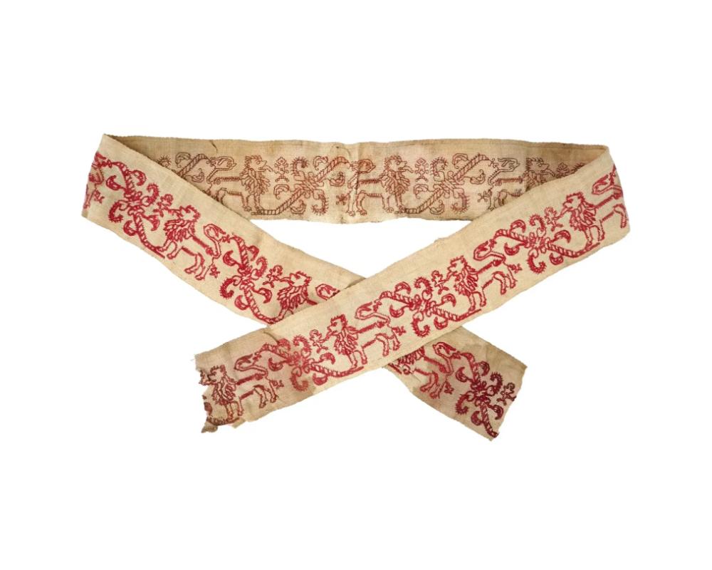 An antique Greek hand embroidered cotton textile tape or fragment. The textile is adorned with a hand embroidered red lion and foliage designs. Circa: late 18th century. Antique European Textiles, Embroidered Tapestry Blankets, Wall Hangings, Home