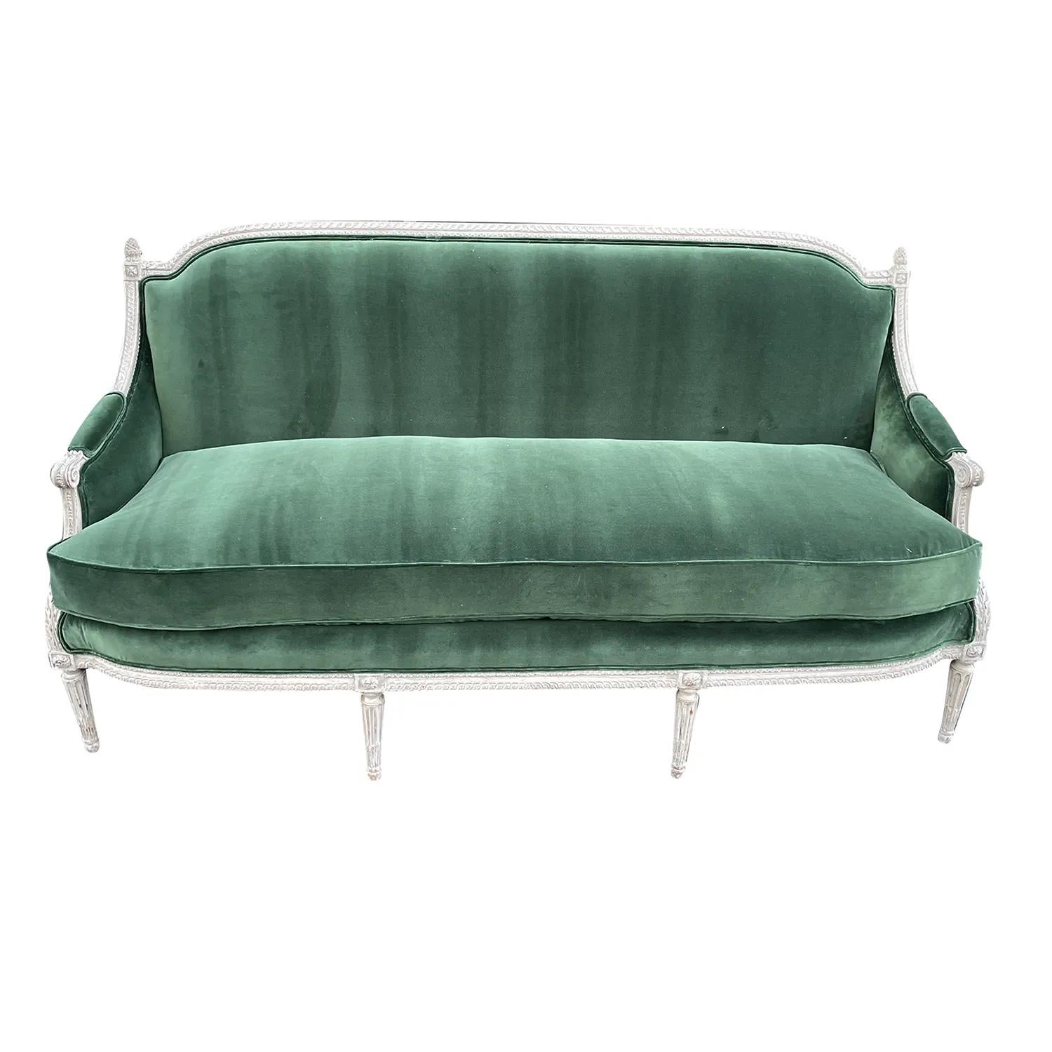 An 18th Century French three seater sofa, stamped Sulpice Brizard (Master 1762) 1735-1796. The hand crafted Parisian settee has a partial carved, painted grey Beechwood frame, in good condition. Newly upholstered in a green velour from Lelièvre