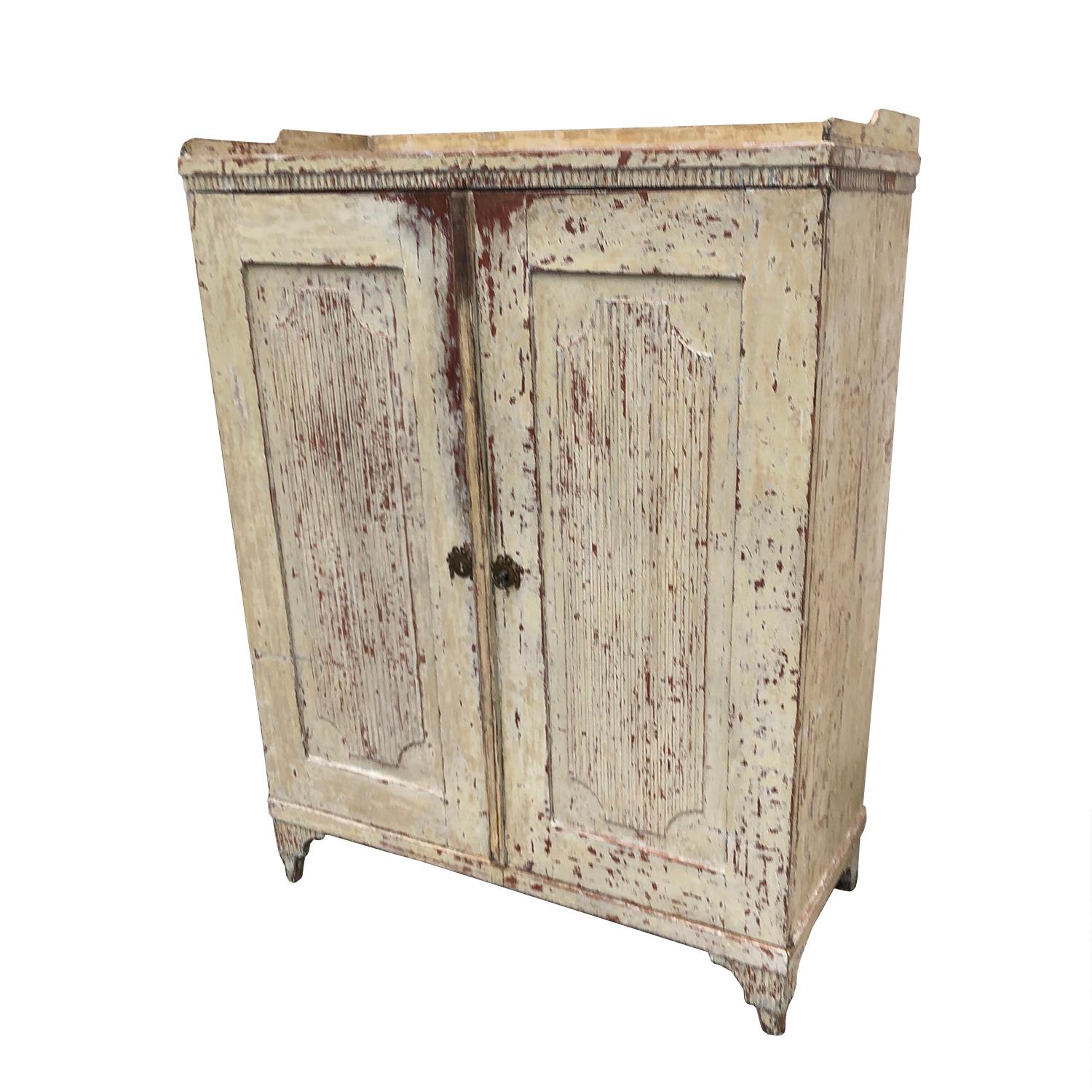 This Swedish Gustavian buffet has been dry scraped to its original paint. This piece features a two-door reeded front and is a useful storage piece of good proportions.