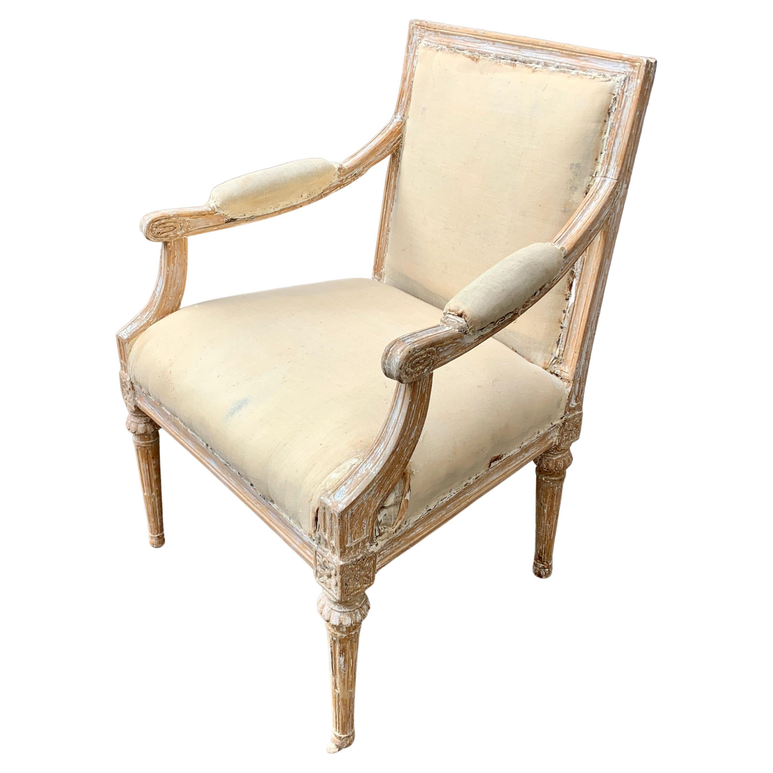 Turn off the 19th Century Swedish armchair with original patina and paint. This Scandinavian settee has been carefully hand-scraped by our restoration team to preserve what was left of the original surface. The quality of the carving and the