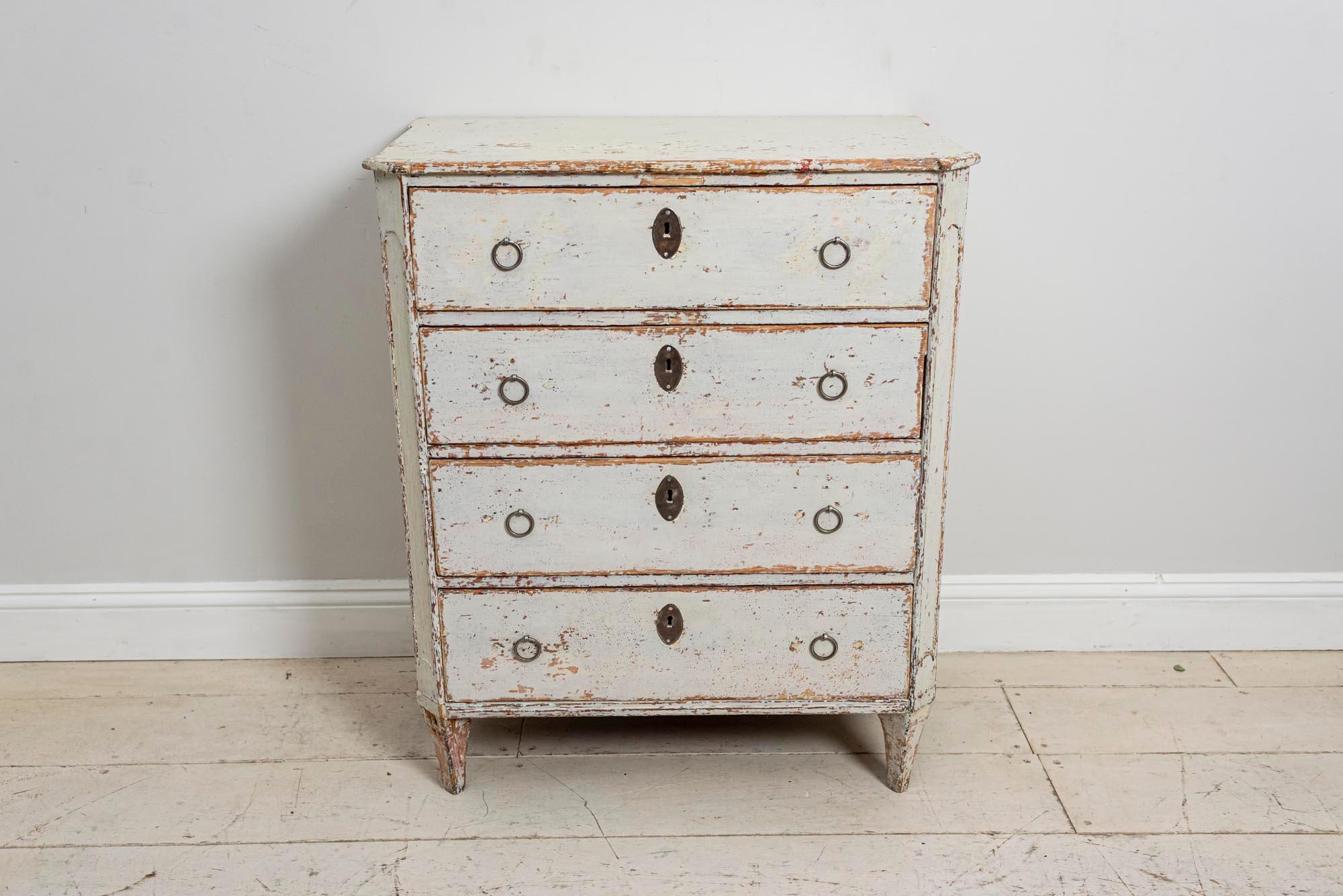 An interesting 18th century compact four-drawer commode. The top drawer contains a feature fall front pull-out writing desk or bureau. It’s interior has a lovely well-worn appearance with useful small storage drawers and shelf. A perfect place to