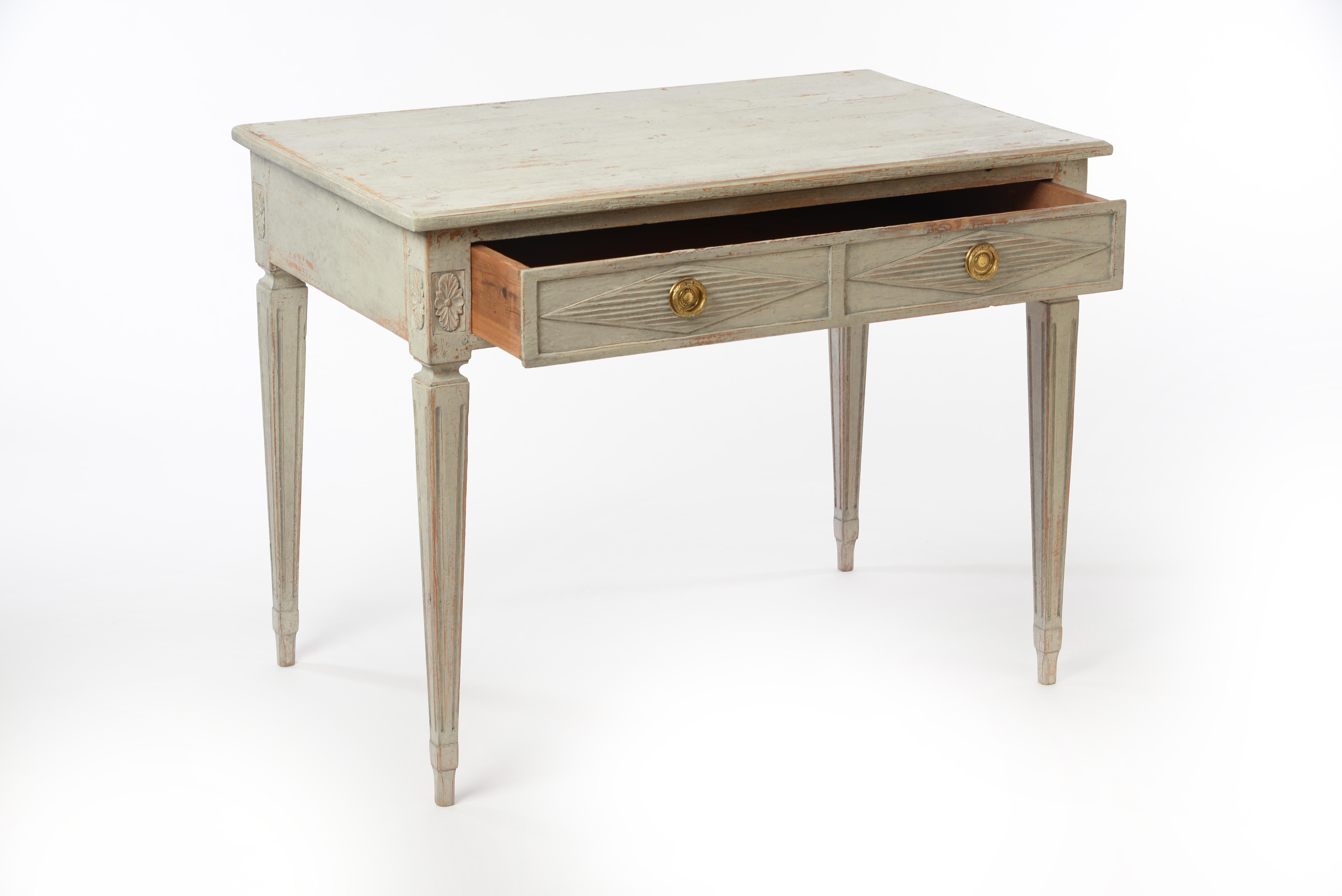 Gorgeous 18th century Gustavian writing desk with large front drawer. A truly beautiful piece that can also function as a console table. Very elegant and clean table with subtle carvings and decorations. Hardware not original to the piece. 