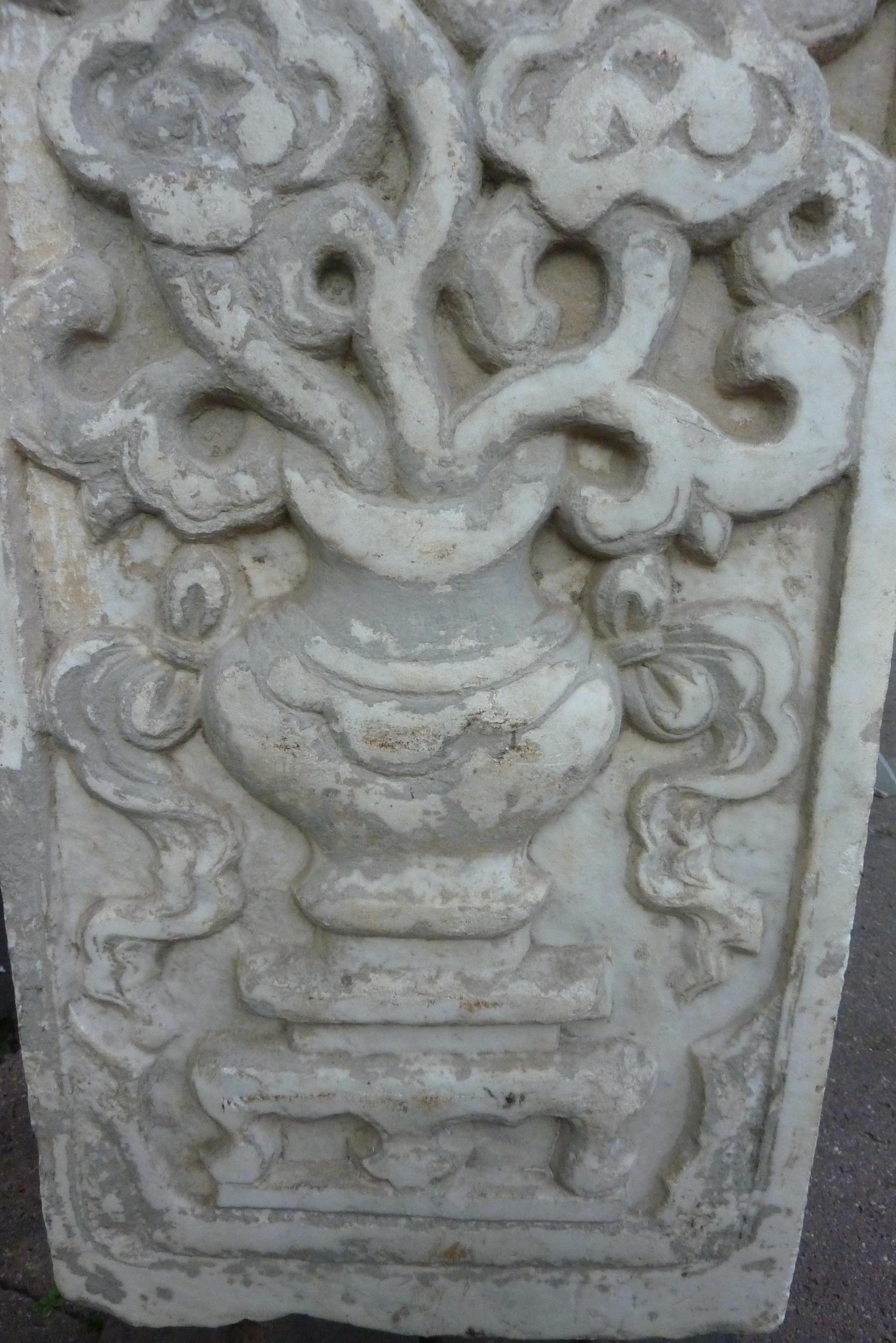 This Qing dynasty 18th-early 19th century marble block, has been seated in a wall.
The carving is a representation of the lingzhi fungus mushroom. These lingzhi fungus mushrooms are Chinese symbols of longevity.
To place the block nicely in place,