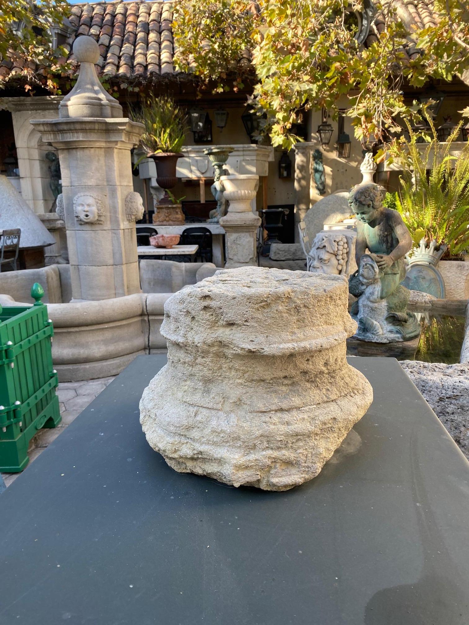 Nicely hand carved 18th century stone column base, it could be used as a capital architectural element in an entryway or as a doorstop, a statement sculpture of carved limestone Chapiteau from a cloister in France. From an ornamental point of view,