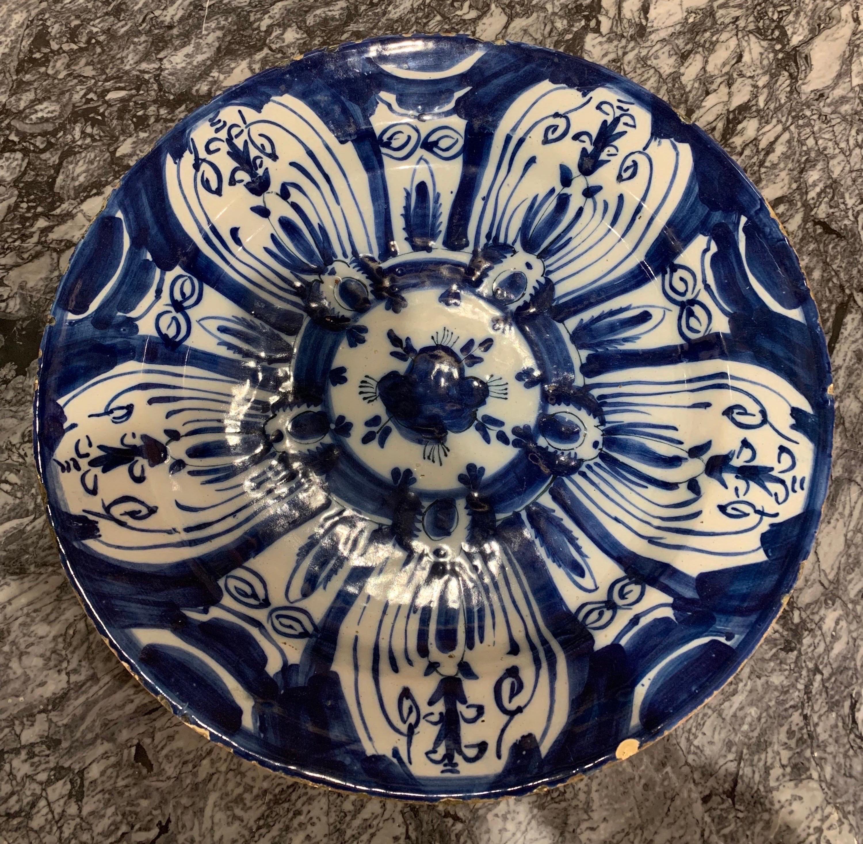 18th century hand painted Dutch delft platter- 14” diameter. Rich dark blue hand painted flower pattern.